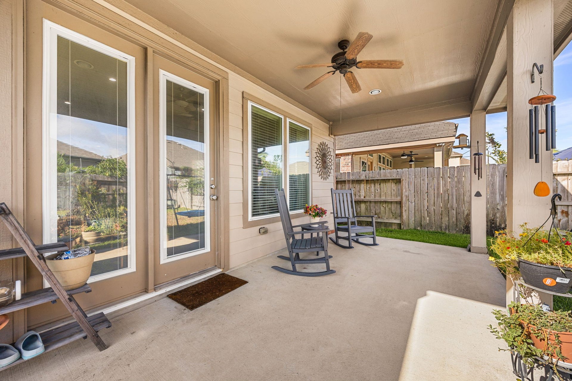 24114 Buffalo Cove Lane, Katy, TX 77493 French doors from the living area open directly to the covered patio, complete with a ceiling fan for added comfort.