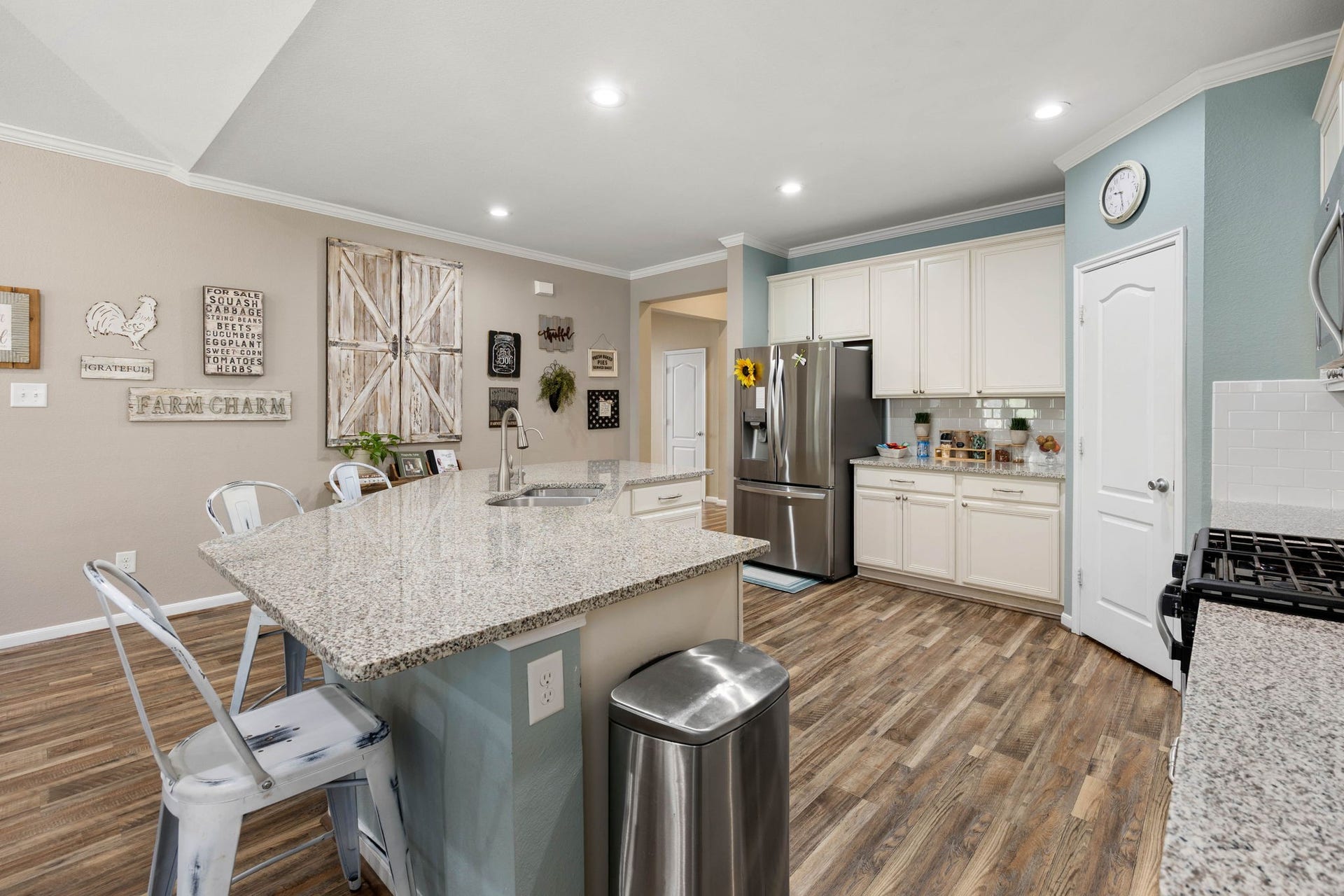 24114 Buffalo Cove Lane, Katy, TX 77493 The oversized island includes the sink and additional workspace, while a walk-in pantry adds valuable kitchen storage.