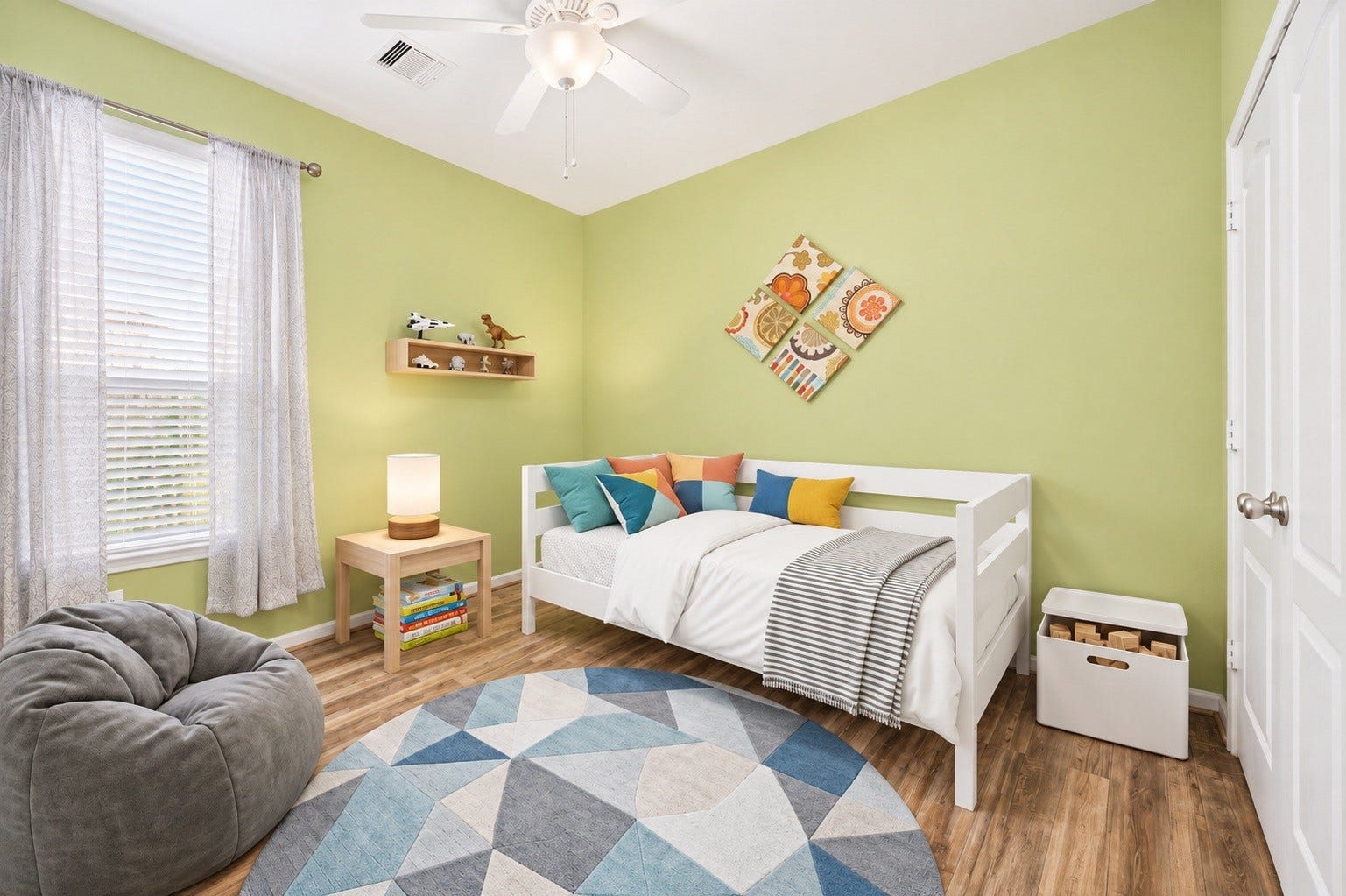 24114 Buffalo Cove Lane, Katy, TX 77493 A third bedroom offers a ceiling fan, wood-look flooring, and a large window that fills the space with natural light.