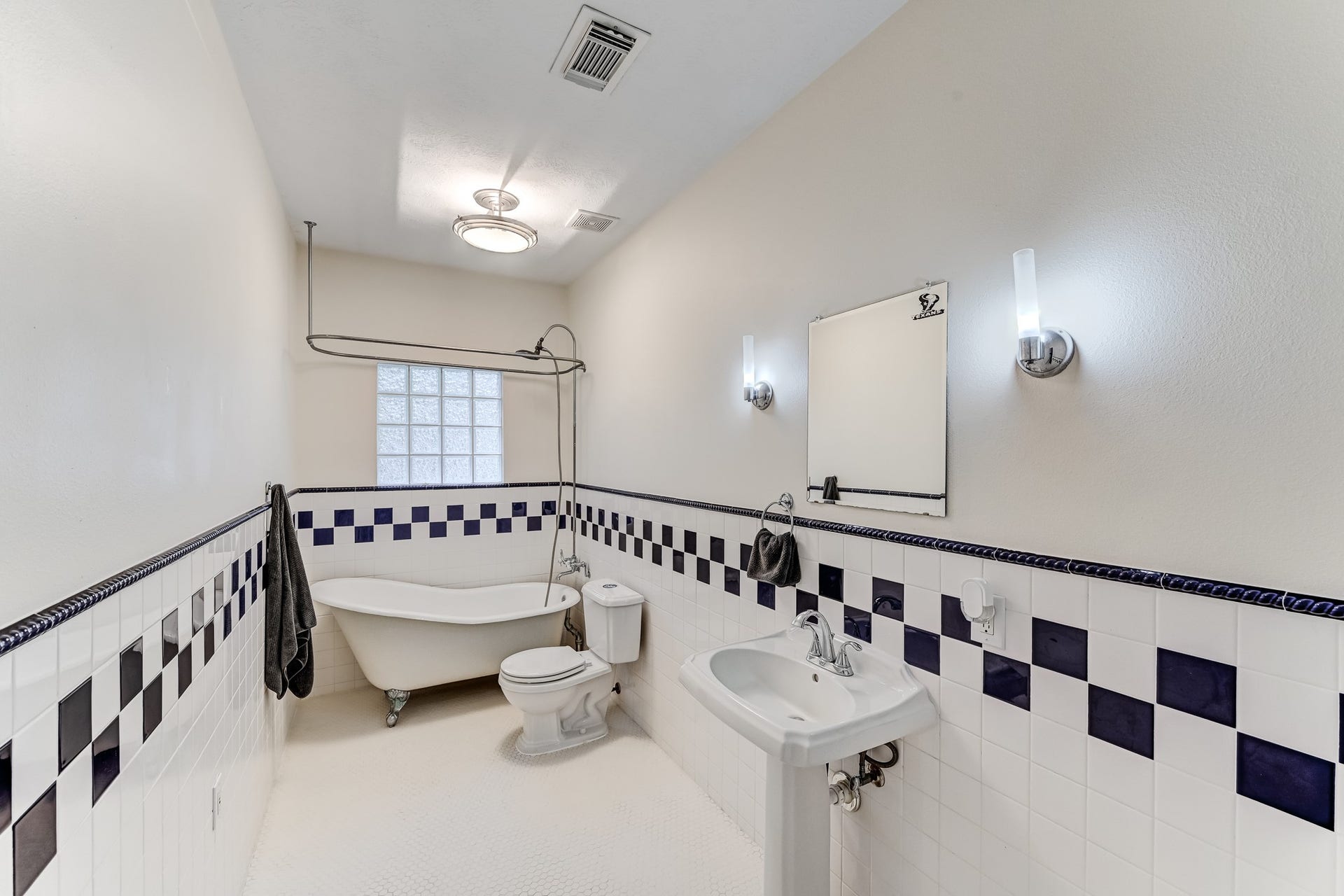 22623 Three Pines Drive, Hockley, TX 77447 Charming hall bath feauturing a clawfoot soaking tub