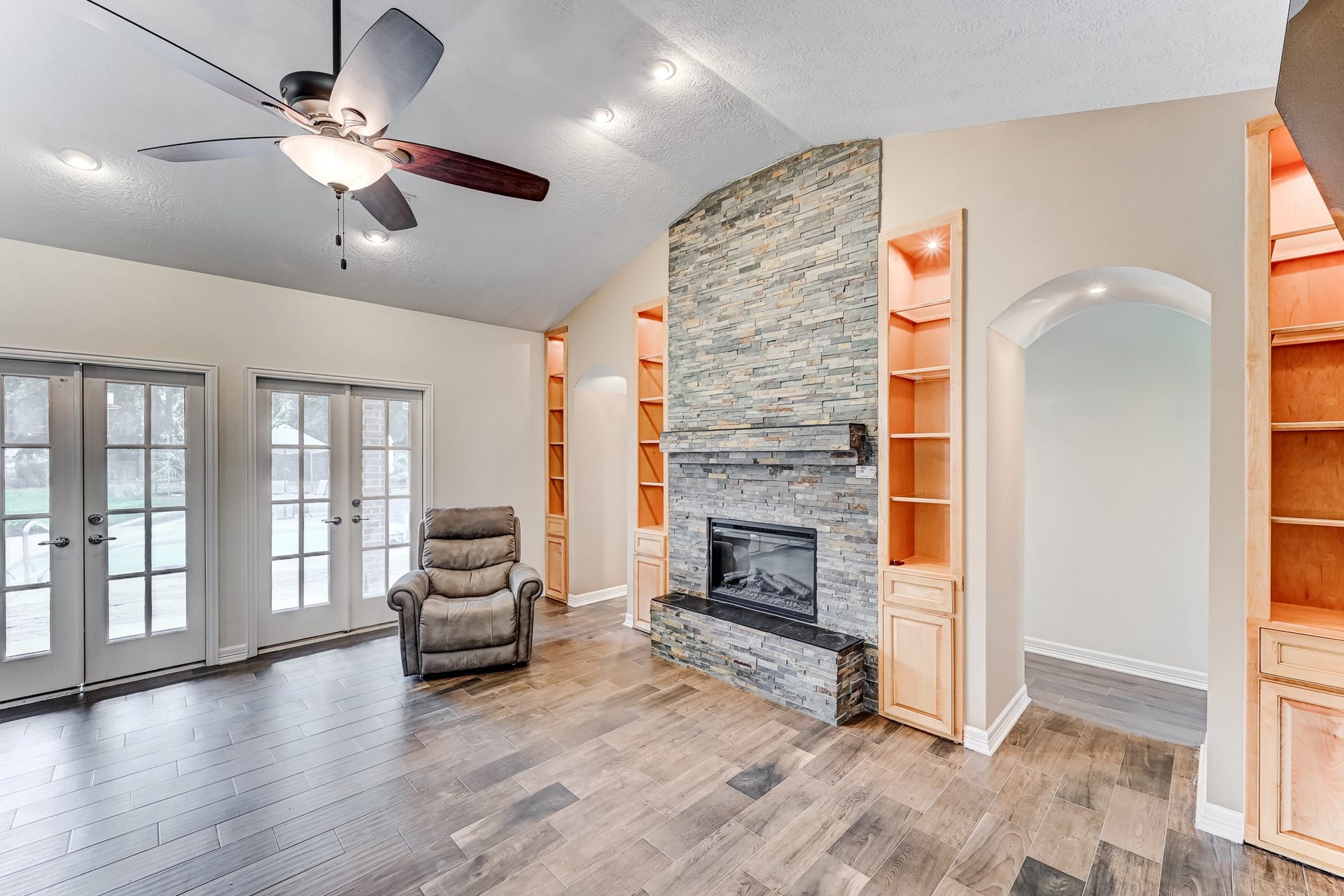 22623 Three Pines Drive, Hockley, TX 77447 Inviting family room with natural light & built ins!