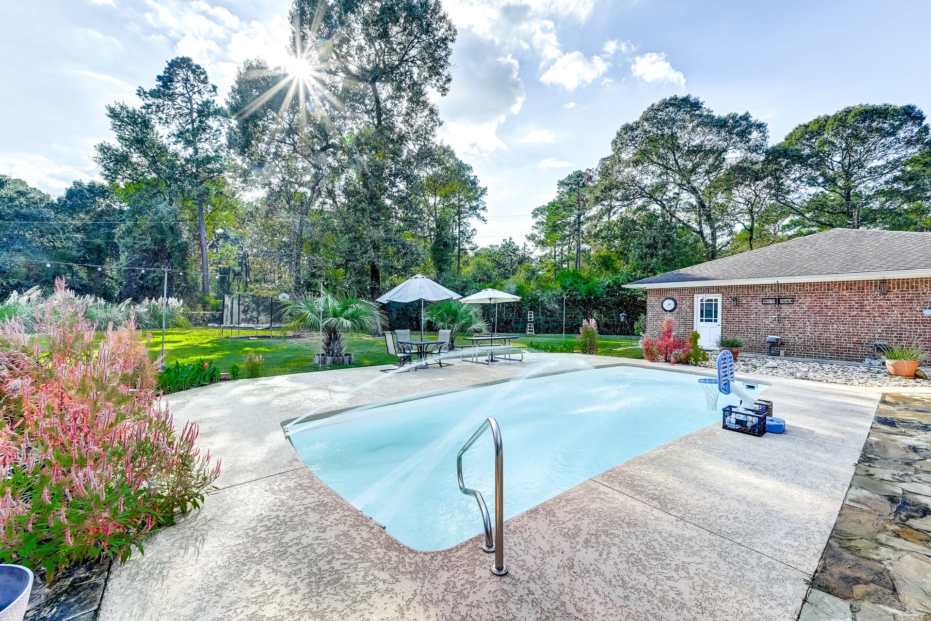 22623 Three Pines Drive, Hockley, TX 77447 Your own backyard oasis featuring a sparkling swimming pool