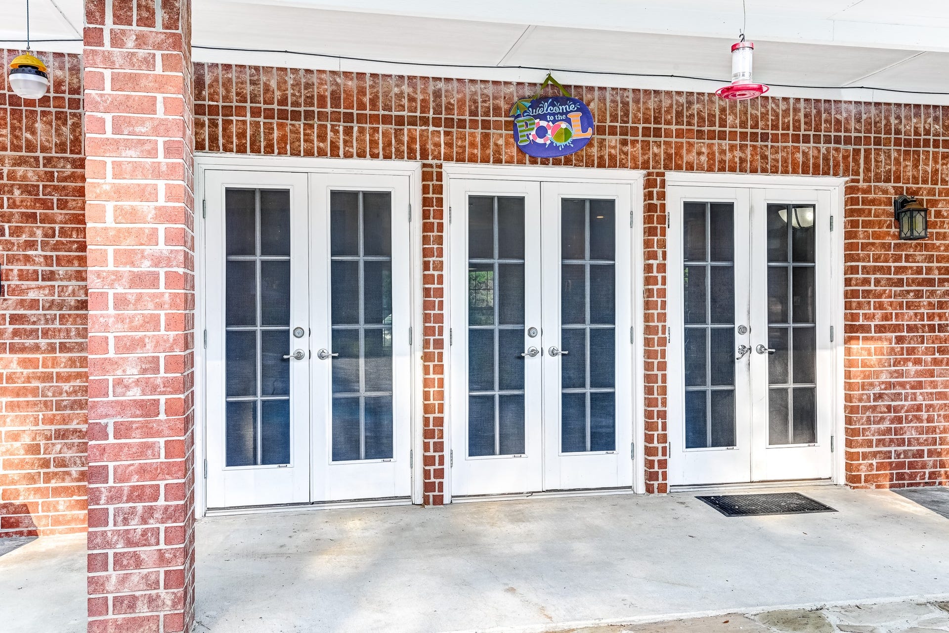 22623 Three Pines Drive, Hockley, TX 77447 Spacious brick patio with French doors, perfect for outdoor entertaining