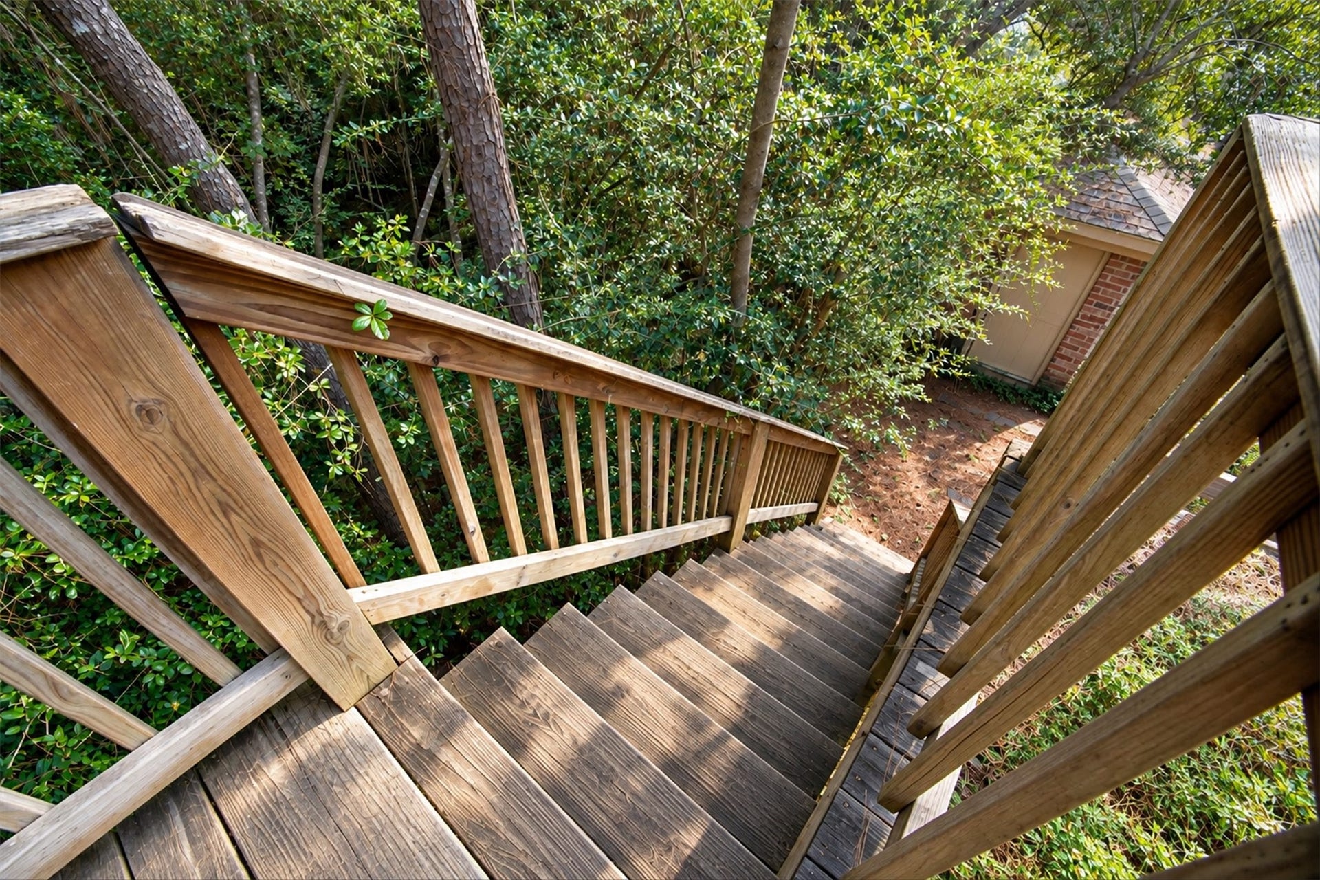 42 Thorn Berry Place, The Woodlands, TX 77381 A deck is off one of the upstairs bedrooms