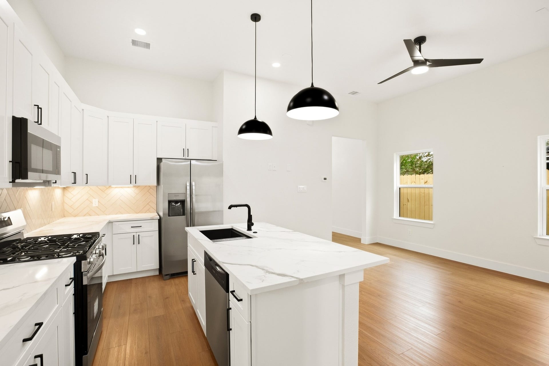 Airy kitchen and dining area with abundant natural light.