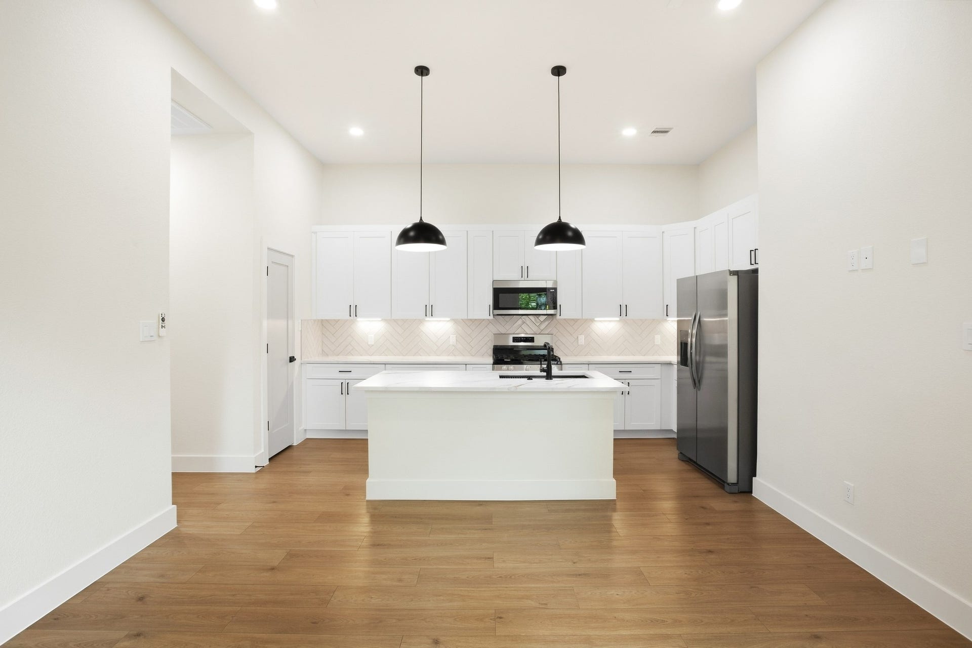 Bright kitchen with generous workspace and a streamlined layout.