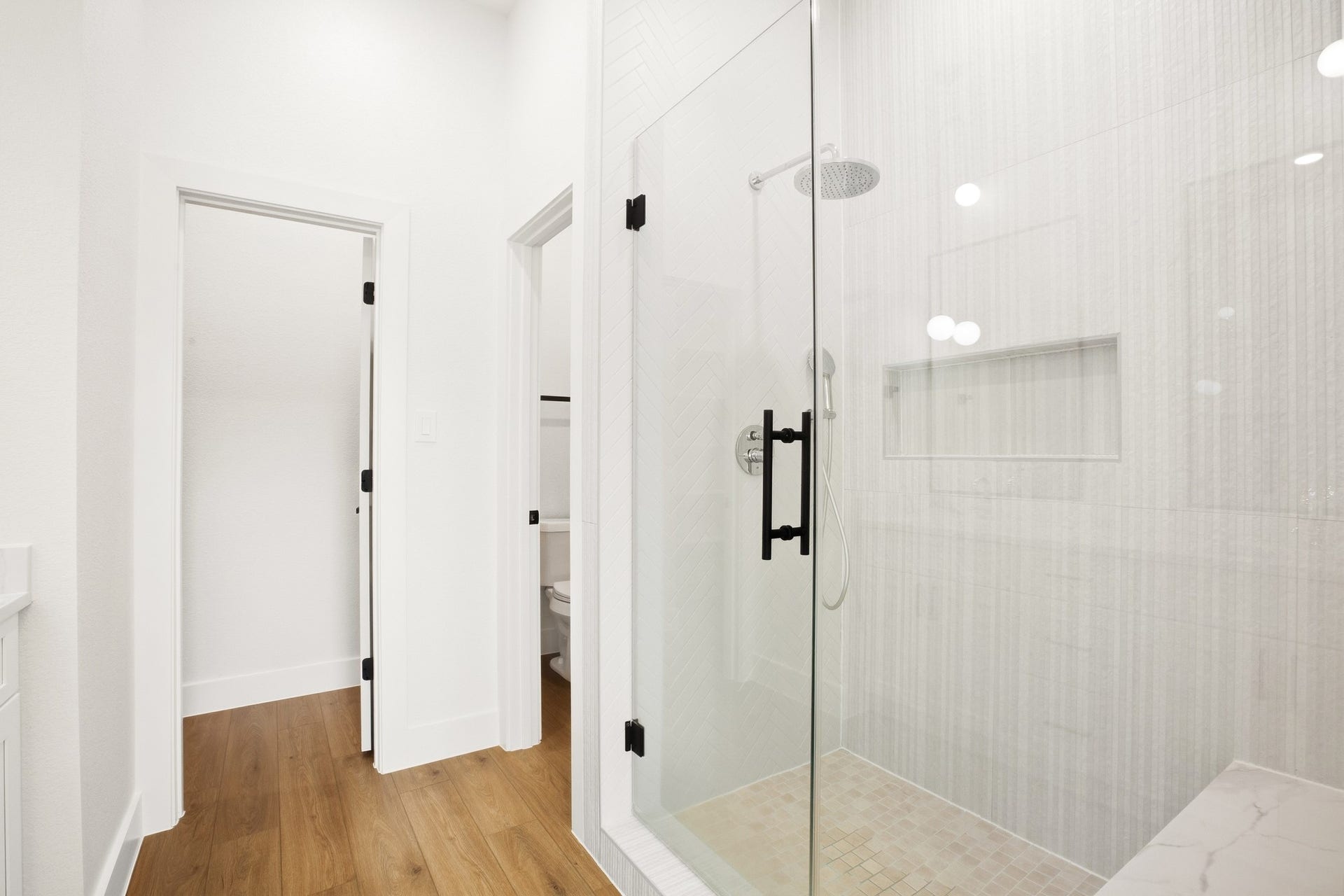 Modern bathroom with a glass-enclosed shower and clean detailing.