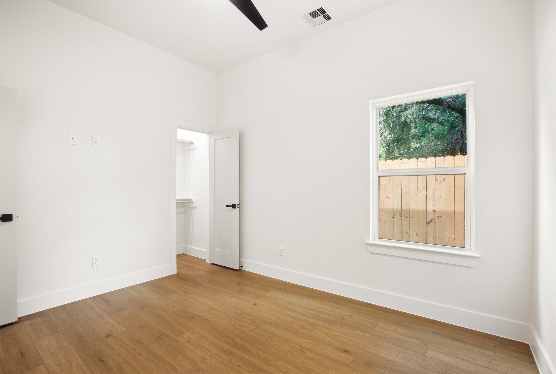 Flexible bedroom space with natural light and modern finishes.