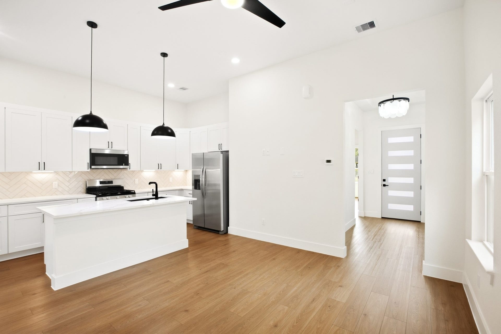 Open-concept kitchen designed around a spacious central island.