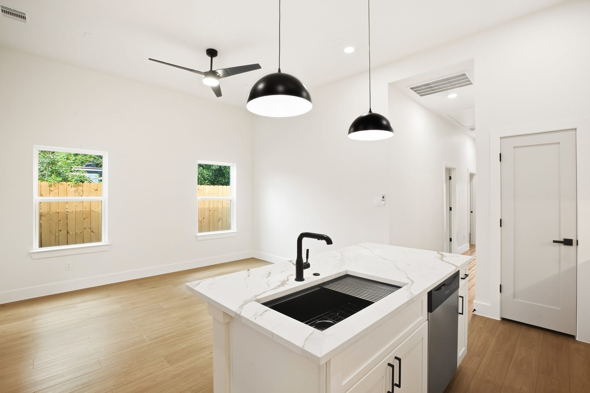 Inviting kitchen with a generous island and elegant pendant lighting.