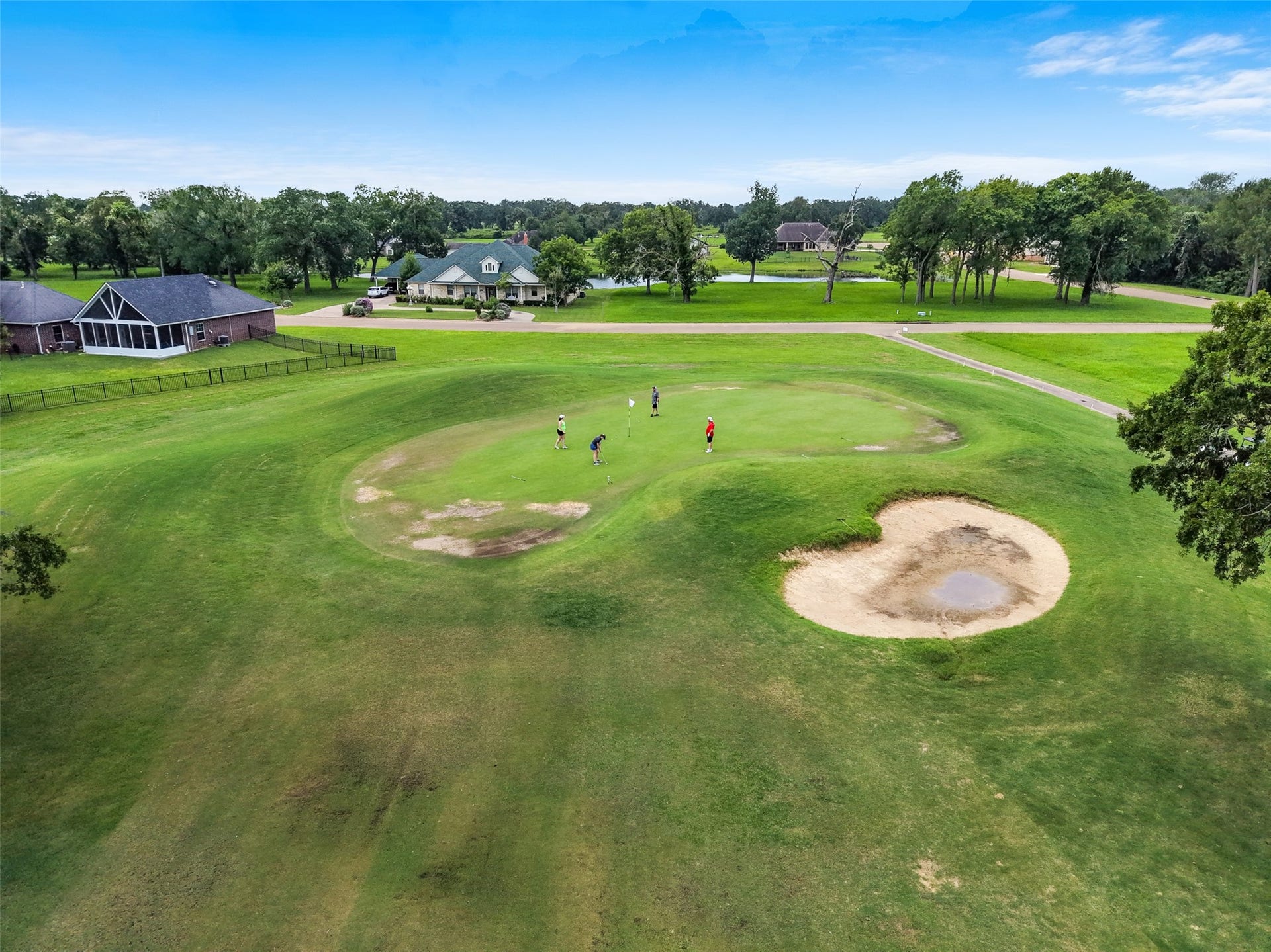 230 Lawrence Marshall Drive, Hempstead, TX 77445 Expansive golf course views create a beautiful backdrop to the home's spacious backyard