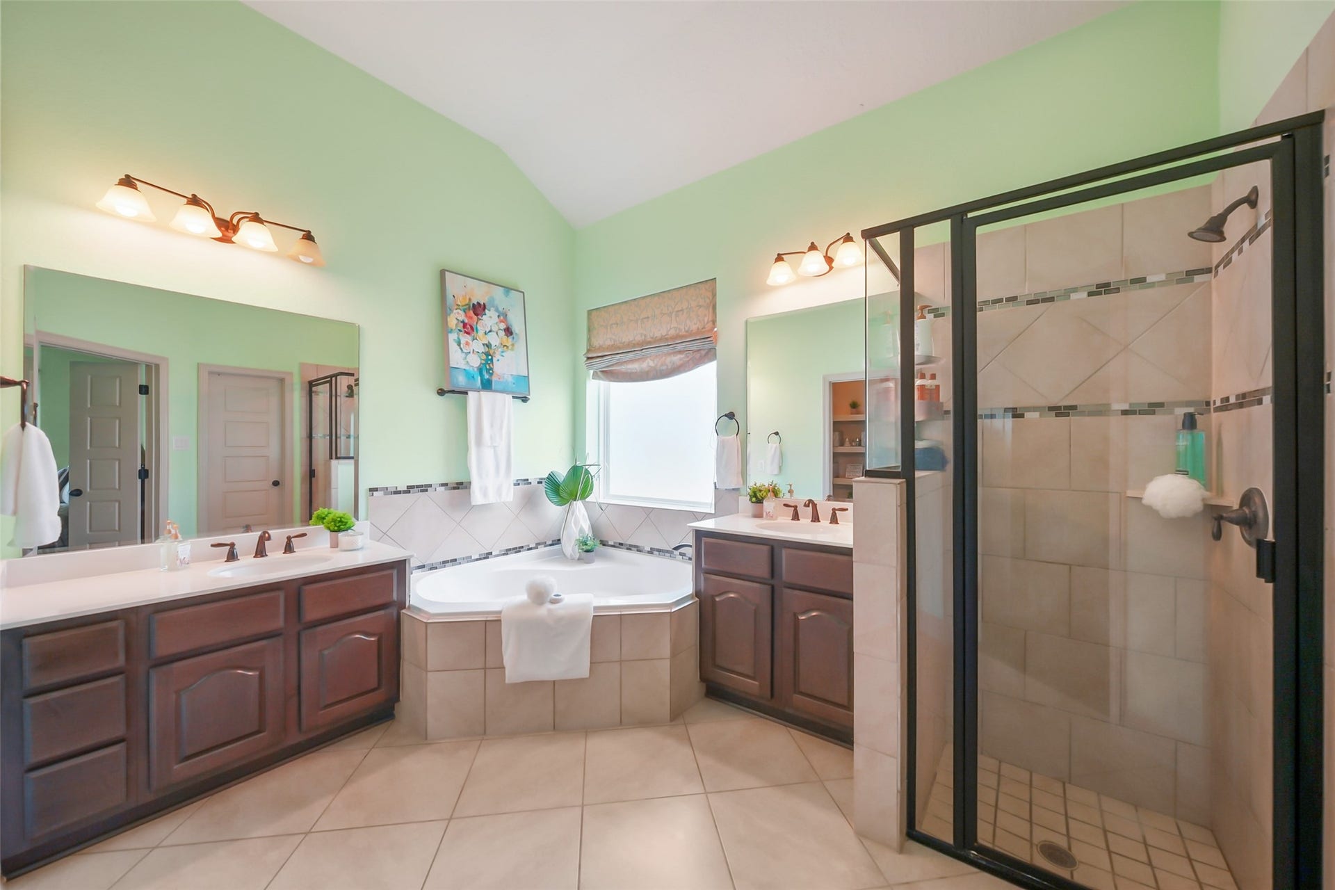 230 Lawrence Marshall Drive, Hempstead, TX 77445 Spacious primary bathroom featuring dual vanities, a soaking tub, and a glass-enclosed walk-in shower.