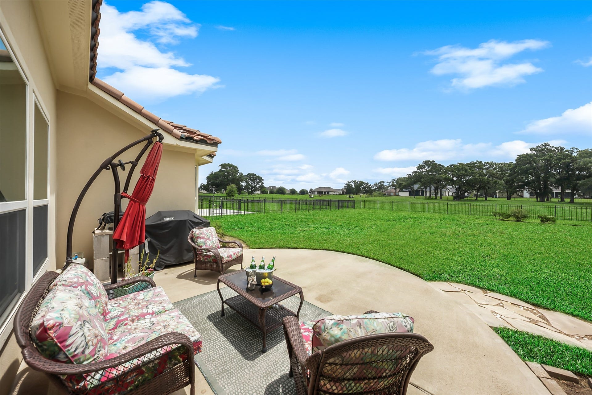 230 Lawrence Marshall Drive, Hempstead, TX 77445 Expansive concrete patio provides plenty of space for outdoor dining, entertaining, grilling, or relaxing while overlooking the large backyard and surrounding acreage.