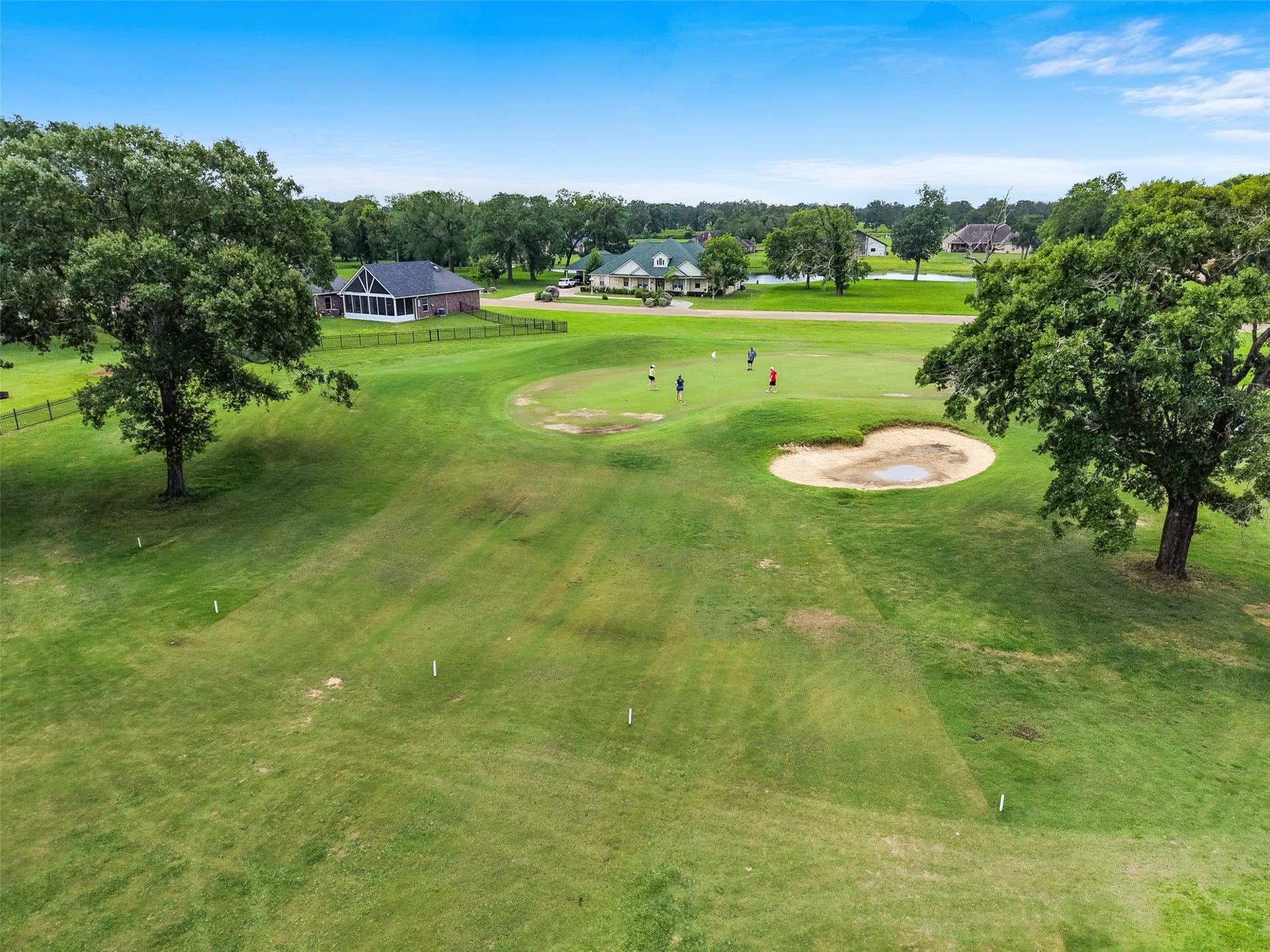 230 Lawrence Marshall Drive, Hempstead, TX 77445 Aerial view showcasing the home's picturesque golf course setting with sweeping fairway views and mature trees.