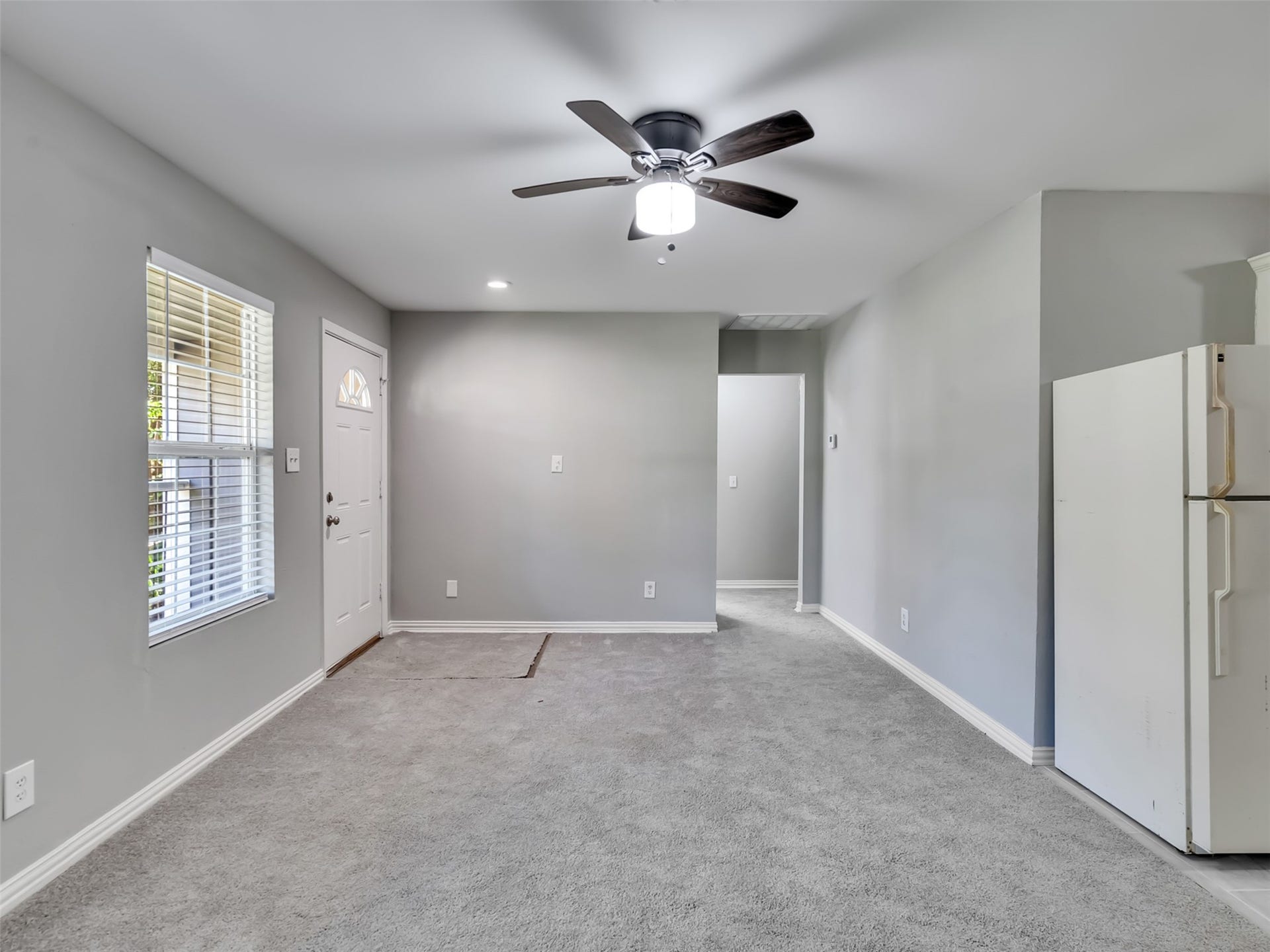 12313 23rd Street, Santa Fe, TX 77510 Living room that looks out onto the front yard.