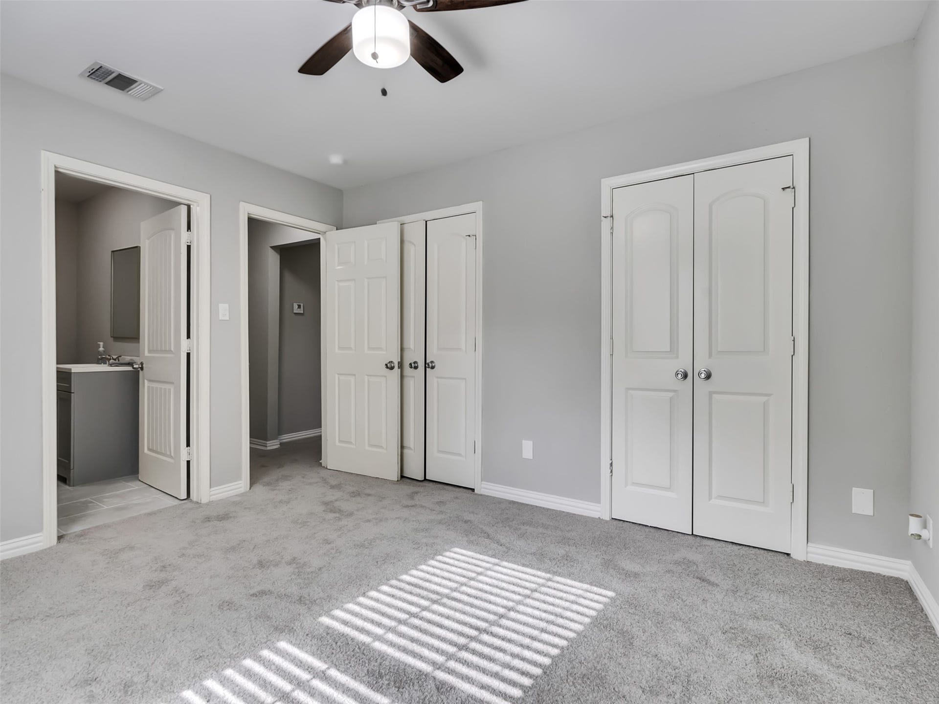 12313 23rd Street, Santa Fe, TX 77510 Primary bedroom with ensuite bathroom.
