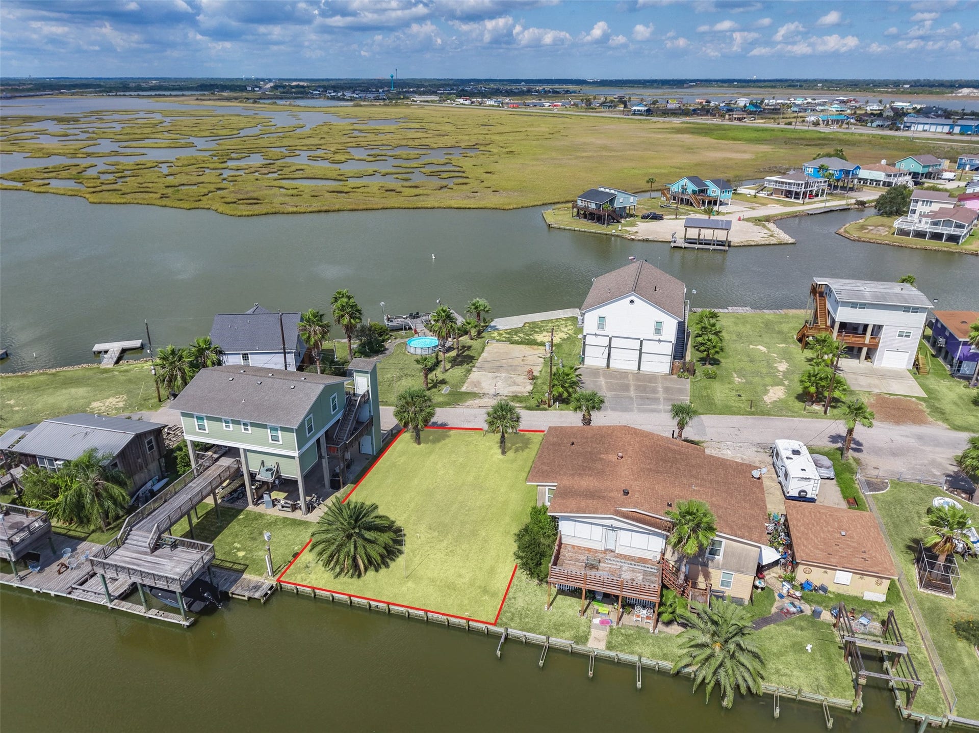 65 Lakeside Drive, Hitchcock, TX 77563 Pull back and the whole picture comes together: canal, marsh and open water past the last row of homes. Galveston is about 8 miles away across the causeway, and Houston is about an hour up I-45.