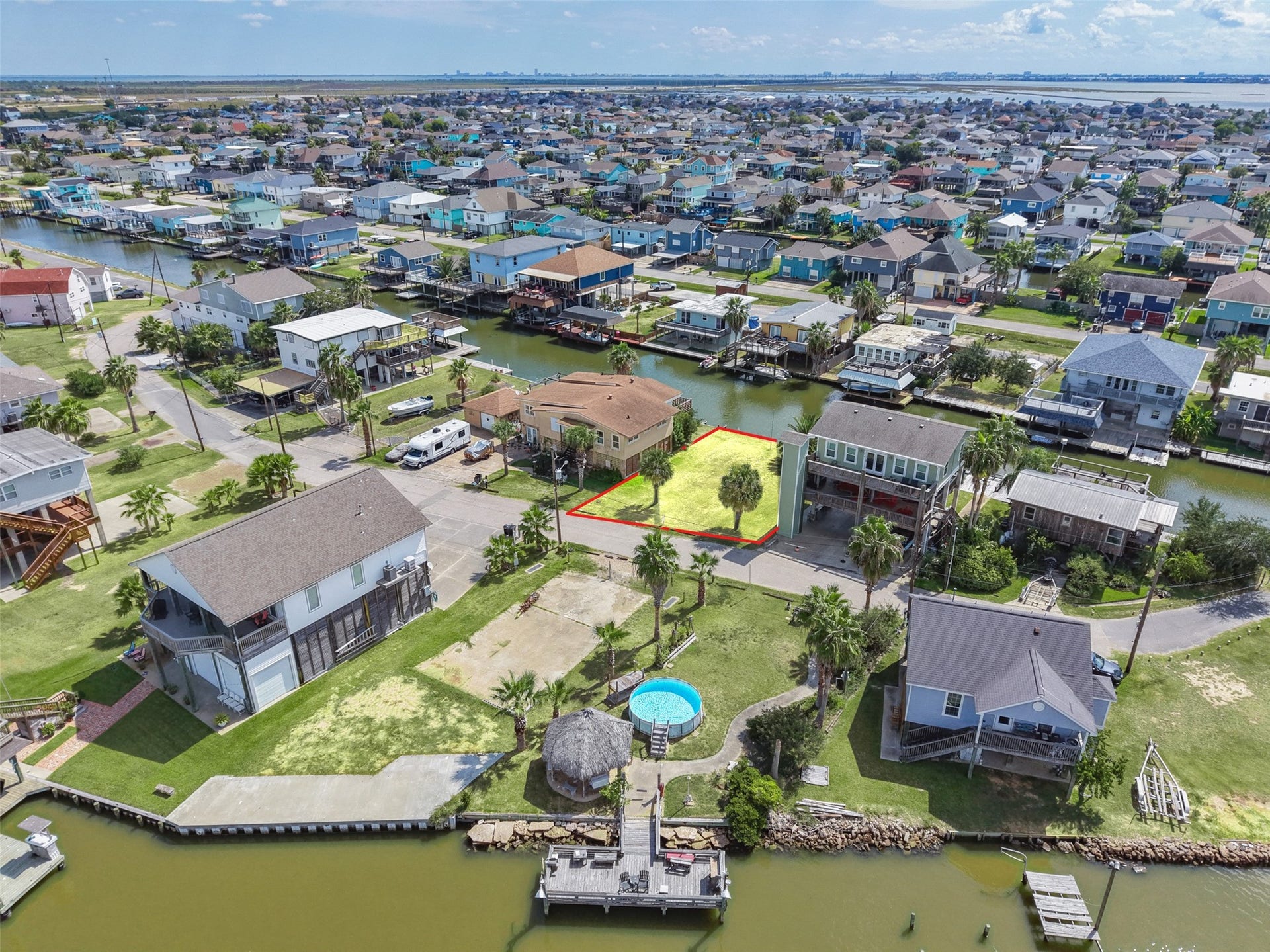 65 Lakeside Drive, Hitchcock, TX 77563 Wide over the neighborhood with the lot highlighted. Original Bayou Vista is unincorporated, with fewer permitting regulations than inside a city. No HOA!