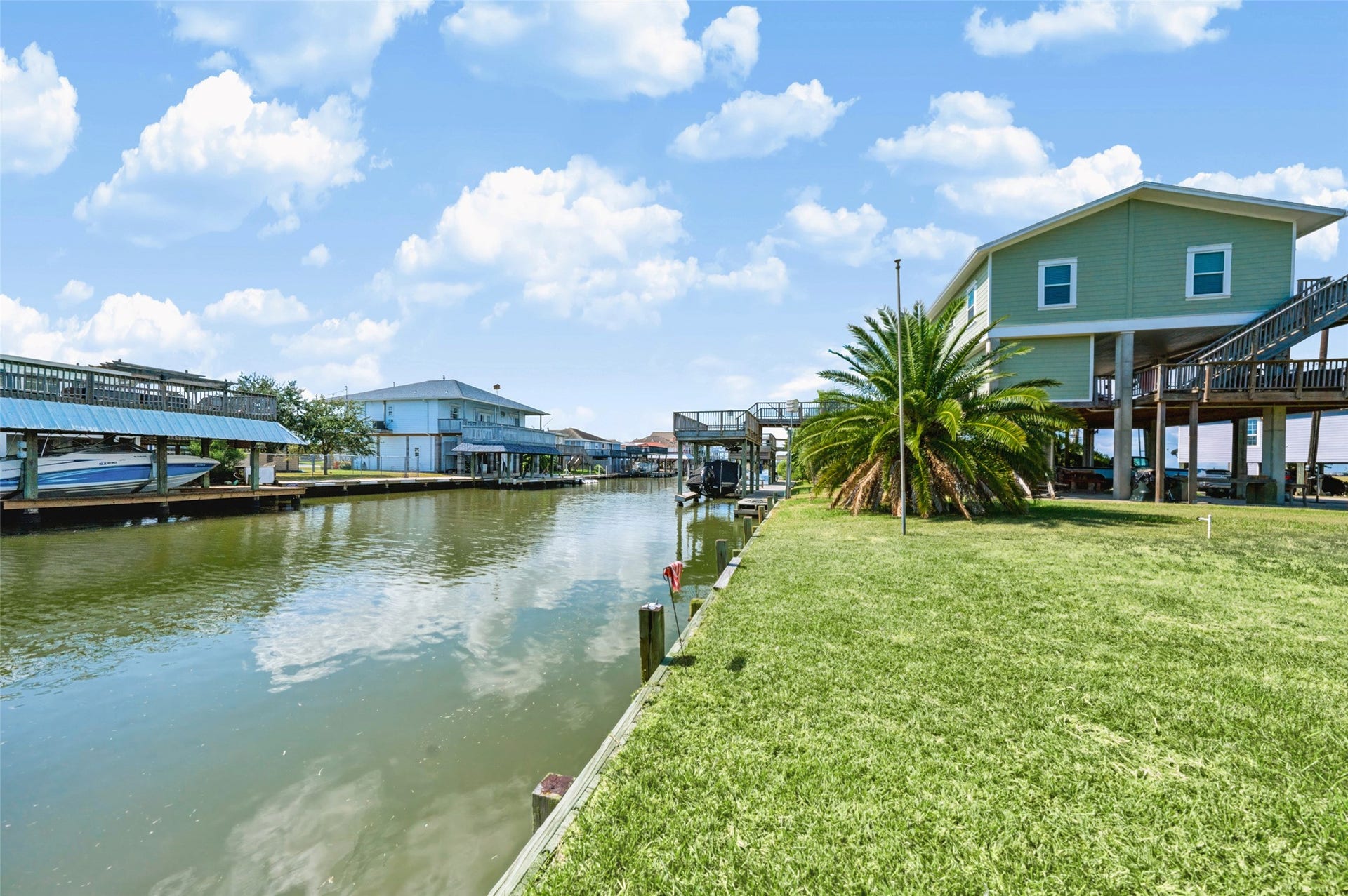 65 Lakeside Drive, Hitchcock, TX 77563 Standing at the bulkhead looking down the canal. Docks and homes line the far side, and the water runs out toward the bay. Launch from your own backyard and be fishing in minutes!