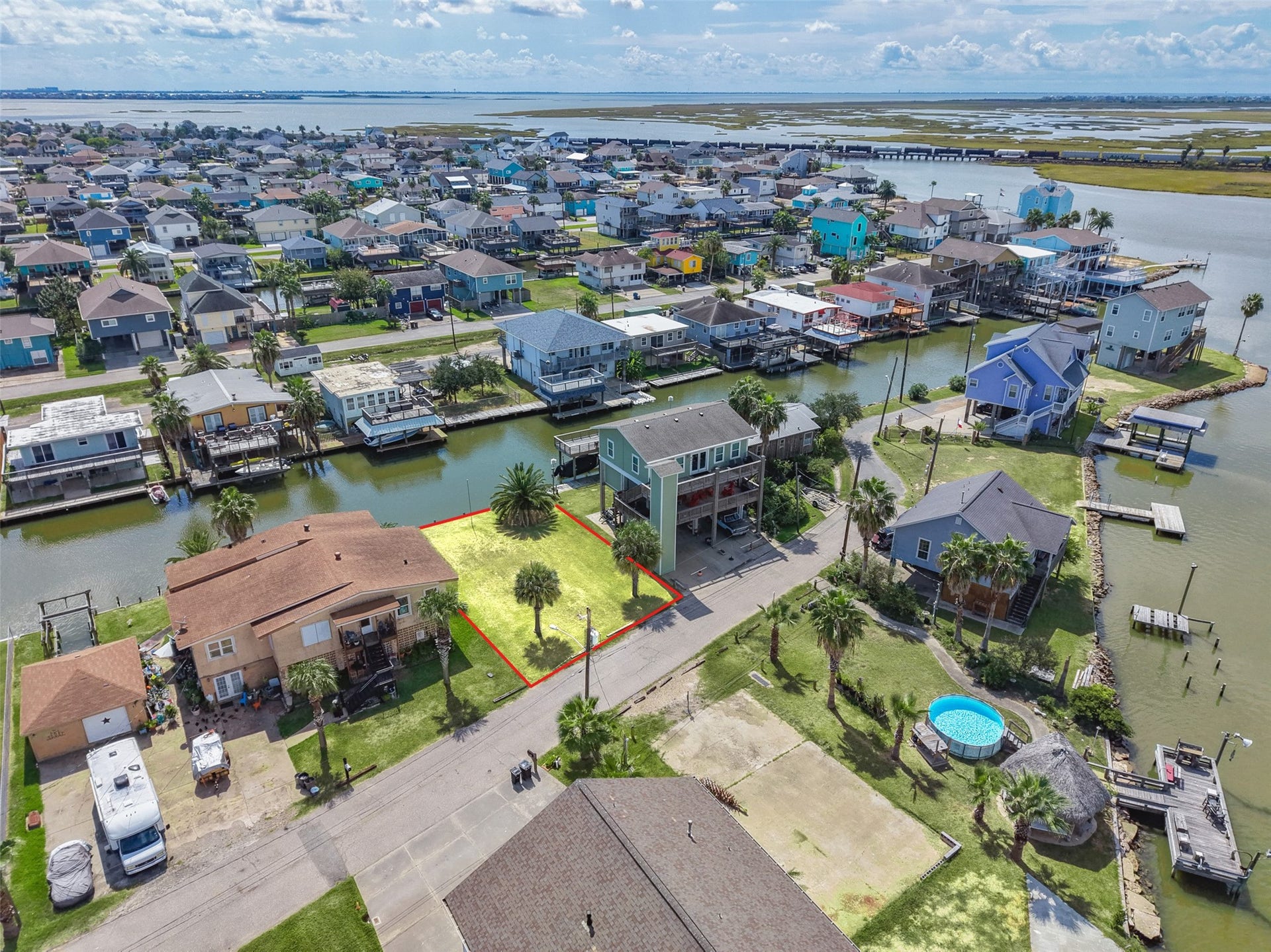 65 Lakeside Drive, Hitchcock, TX 77563 One step farther back. Lower Lakeside Drive is a mix of newer raised homes, docks and boat lifts, with the bay just past the last canal. Bayou Vista's city pool and park are about 0.8 miles away.