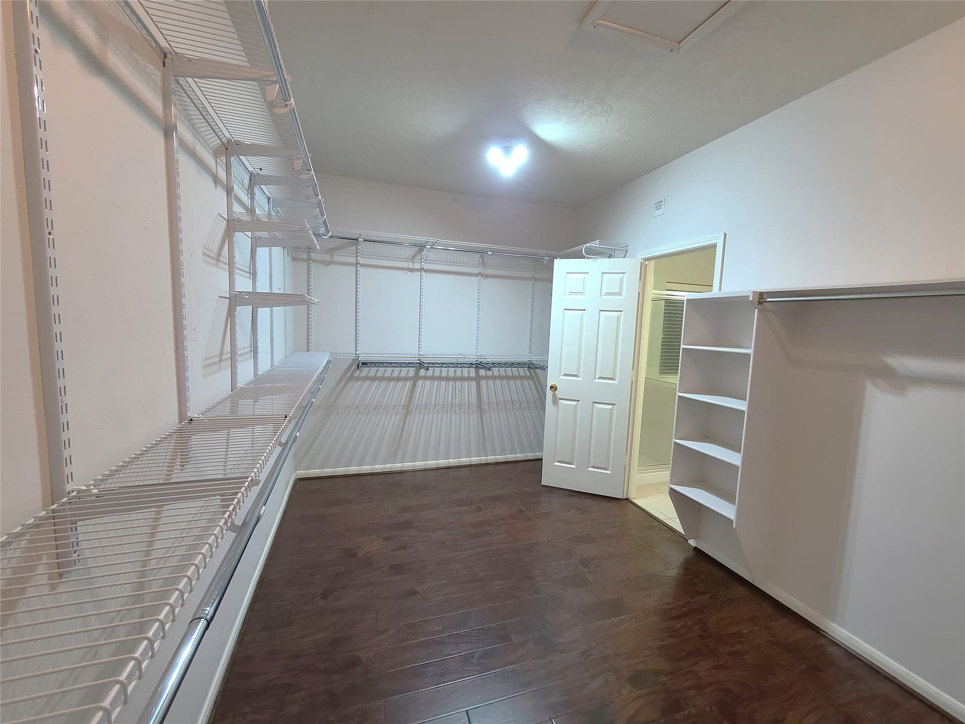 Humongous primary bedroom walk-in closet