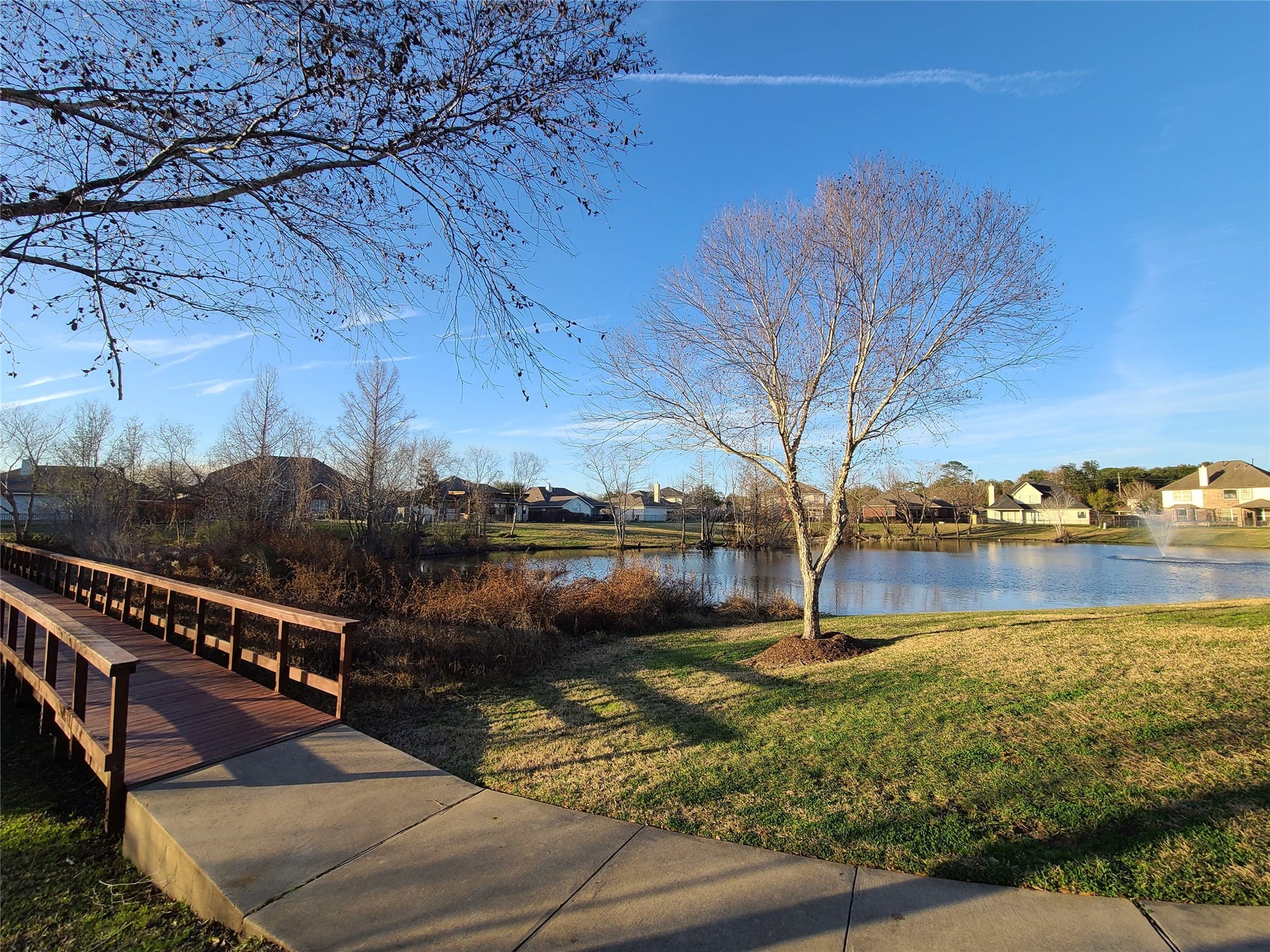 Walking trail surrounds the lake, right across the street from the home
