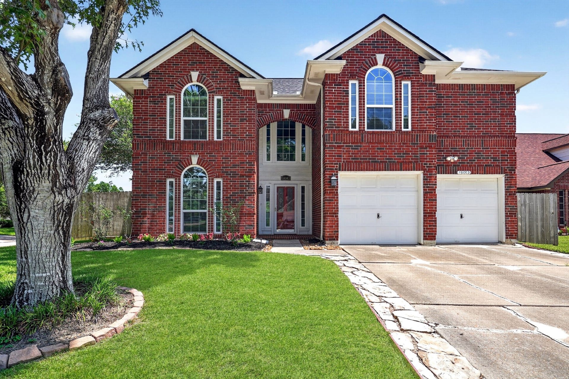 16003 Salton Point Drive, Friendswood, TX 77546 Charming front exterior with established landscaping.