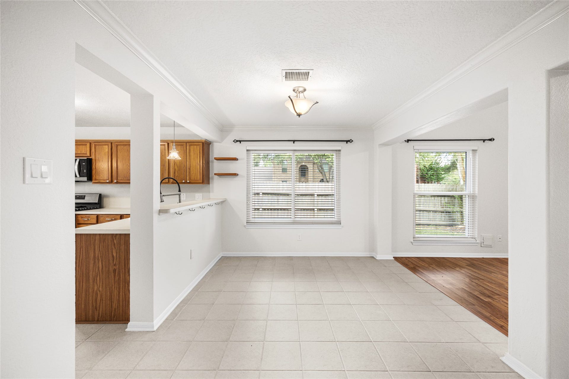 16003 Salton Point Drive, Friendswood, TX 77546 Dedicated dining area, opened to living room and lots of natural light.