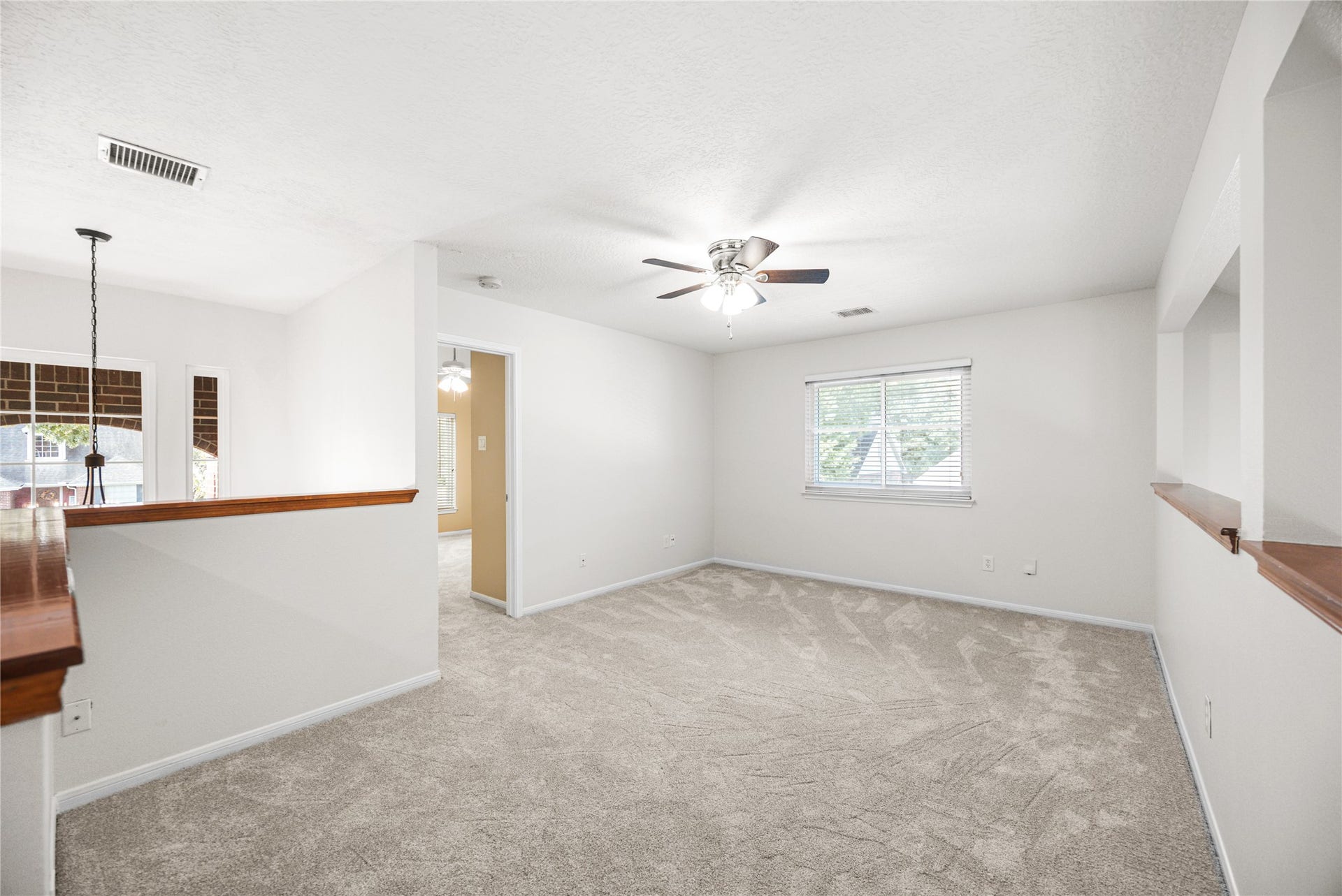 16003 Salton Point Drive, Friendswood, TX 77546 Spacious loft / game room / flex space overlooking the foyer below with fresh new carpet.