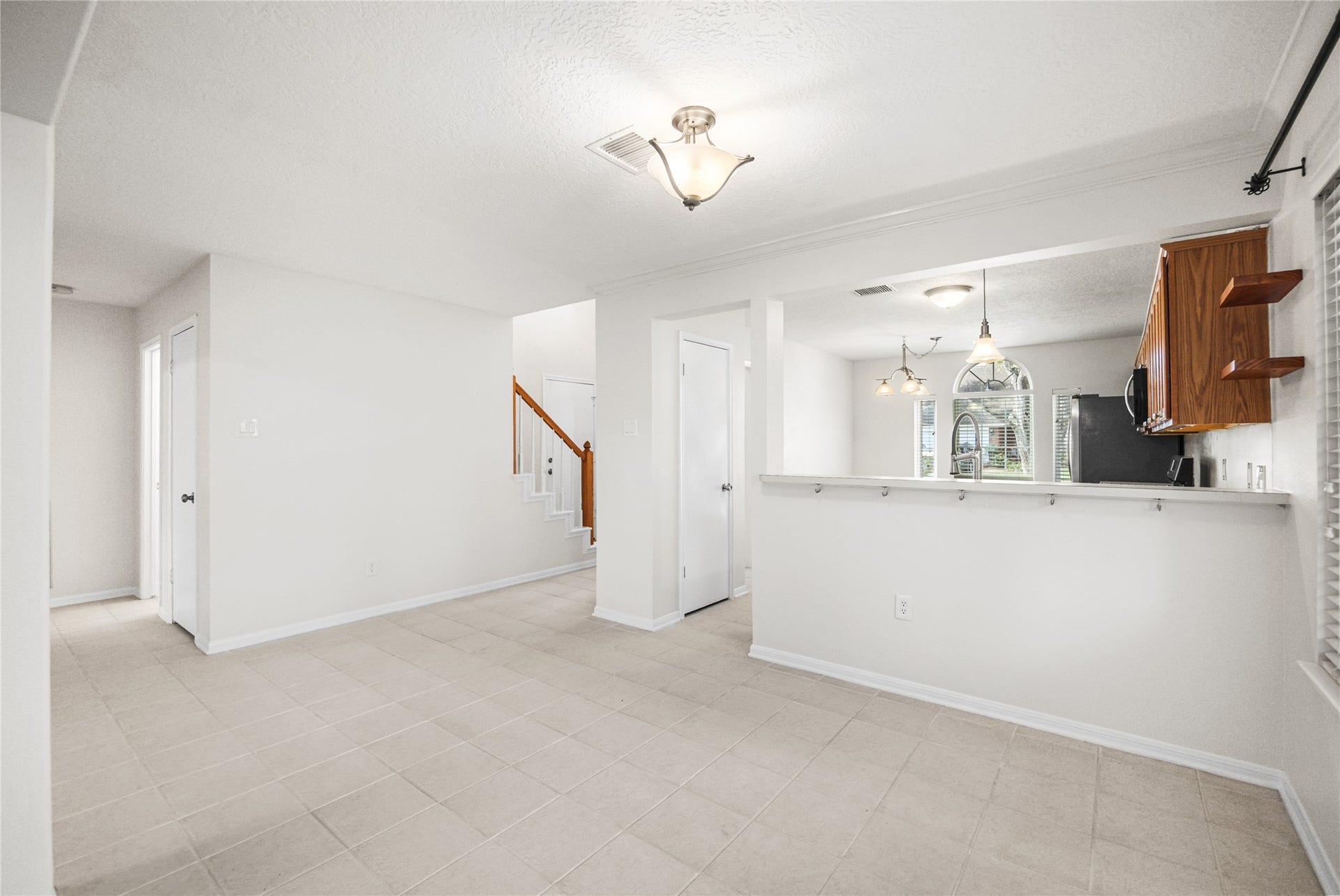 16003 Salton Point Drive, Friendswood, TX 77546 View of dining looking into kitchen and front entrance and hall to