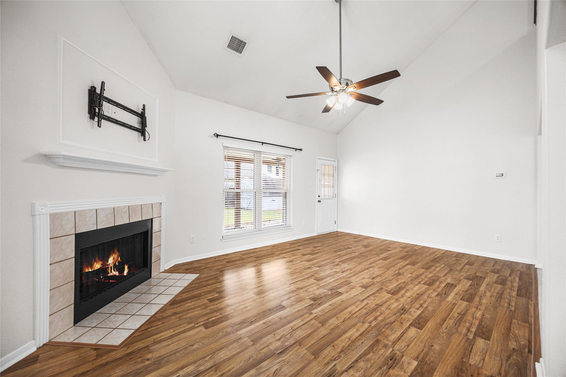 16003 Salton Point Drive, Friendswood, TX 77546 Expansive living room with soaring ceilings and fireplace.