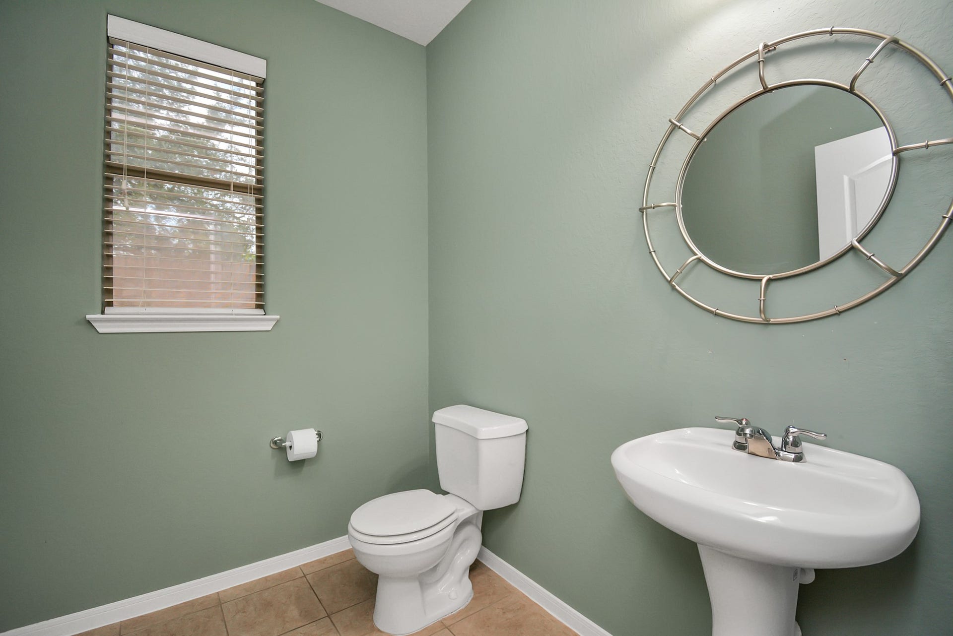 15222 Rigby Point Lane, Cypress, TX 77429 Half bath located on the first level for guests.