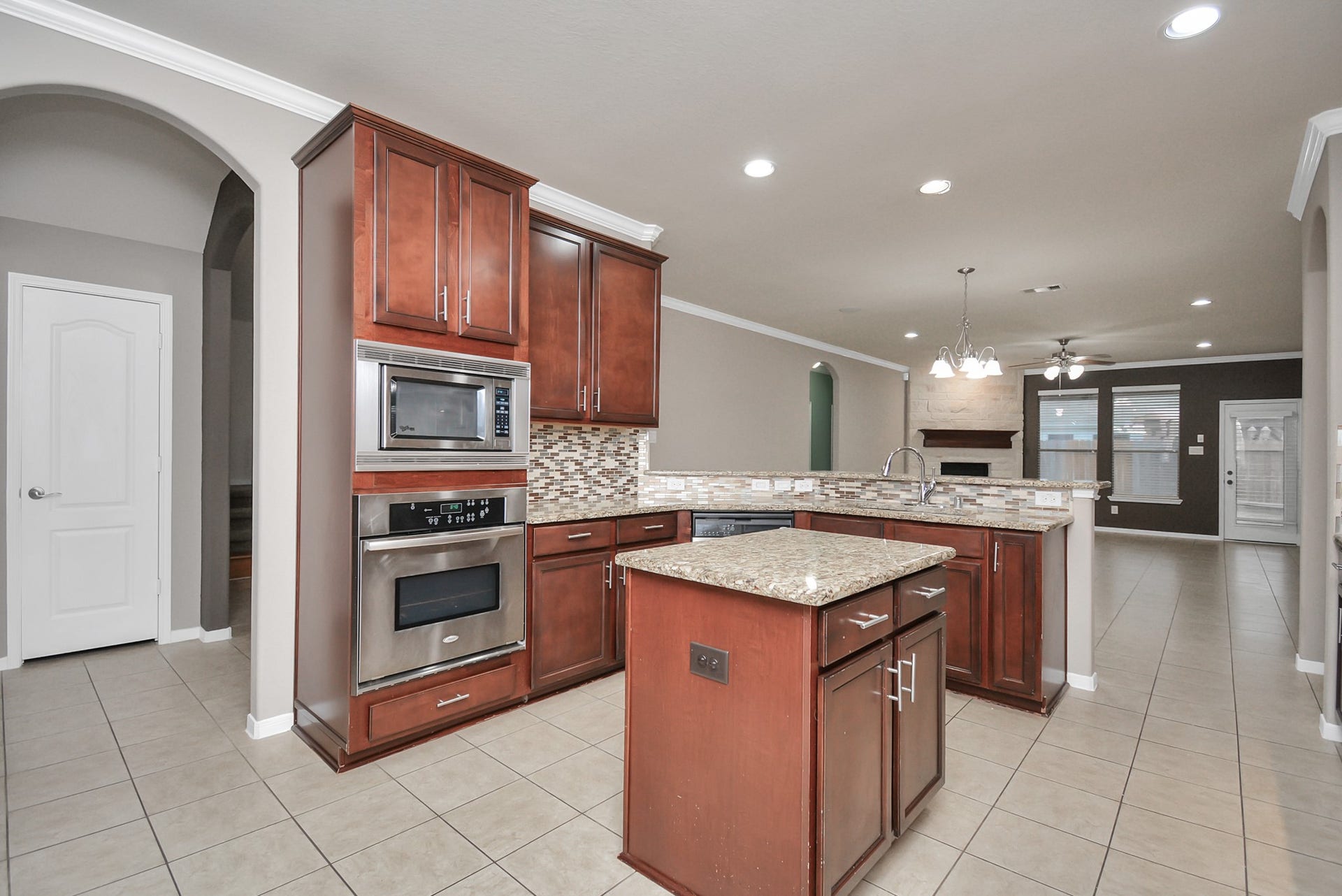 15222 Rigby Point Lane, Cypress, TX 77429 Beautiful granite countertops with an island.