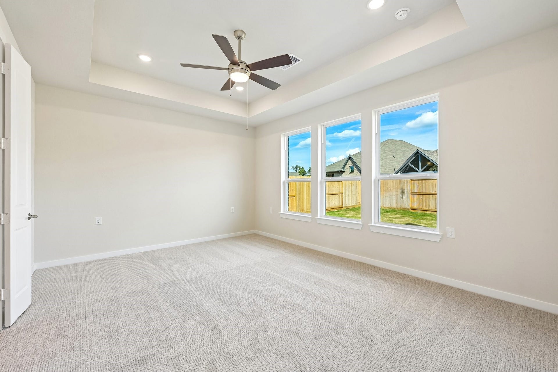 7241 Ironwood Tee Court, Porter, TX 77365 Private primary suite features a tray ceiling, abundant natural light and plenty of room to unwind.