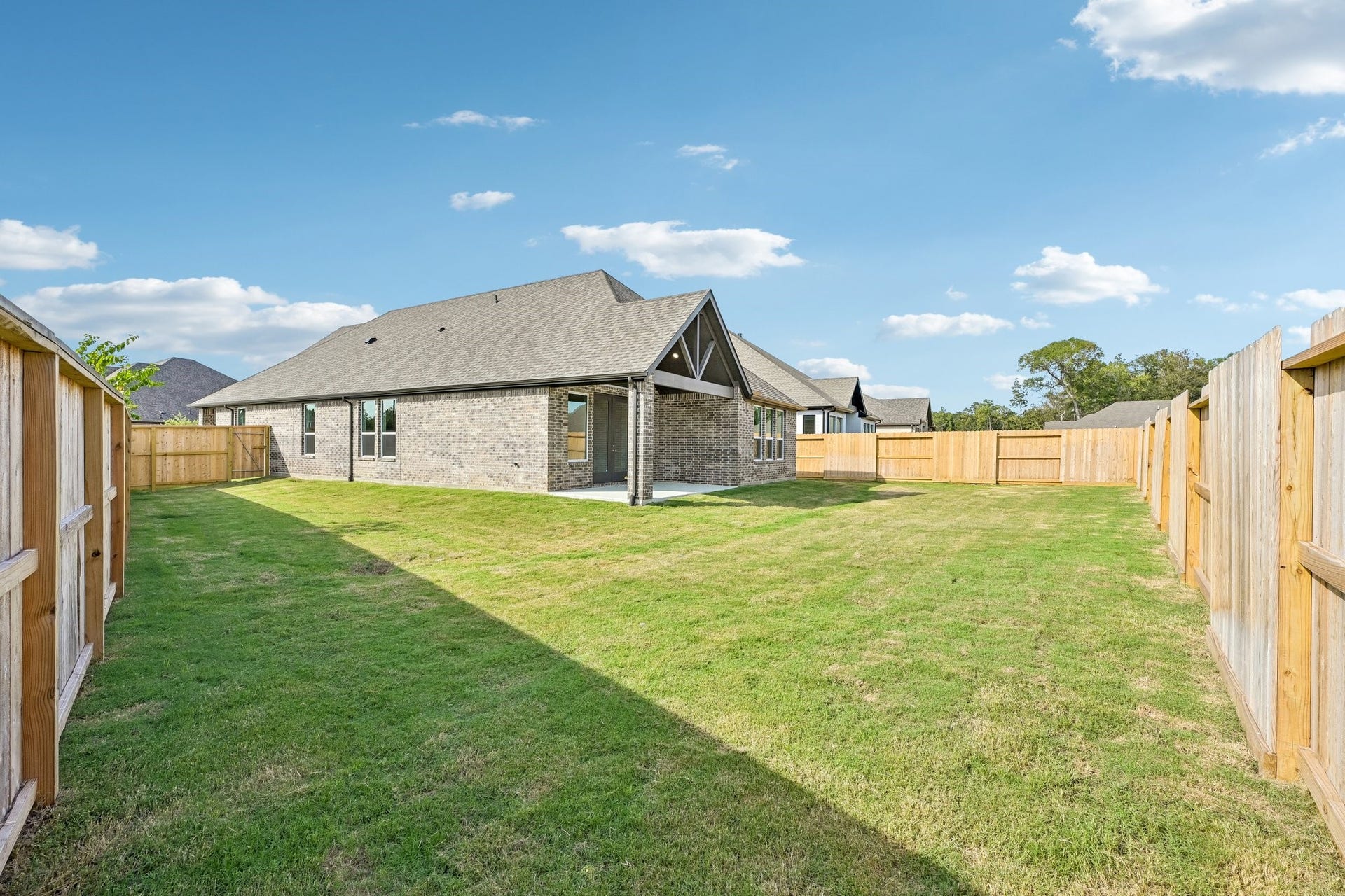 7241 Ironwood Tee Court, Porter, TX 77365 Generous fenced backyard offers plenty of room to enjoy the outdoors from this corner homesite.