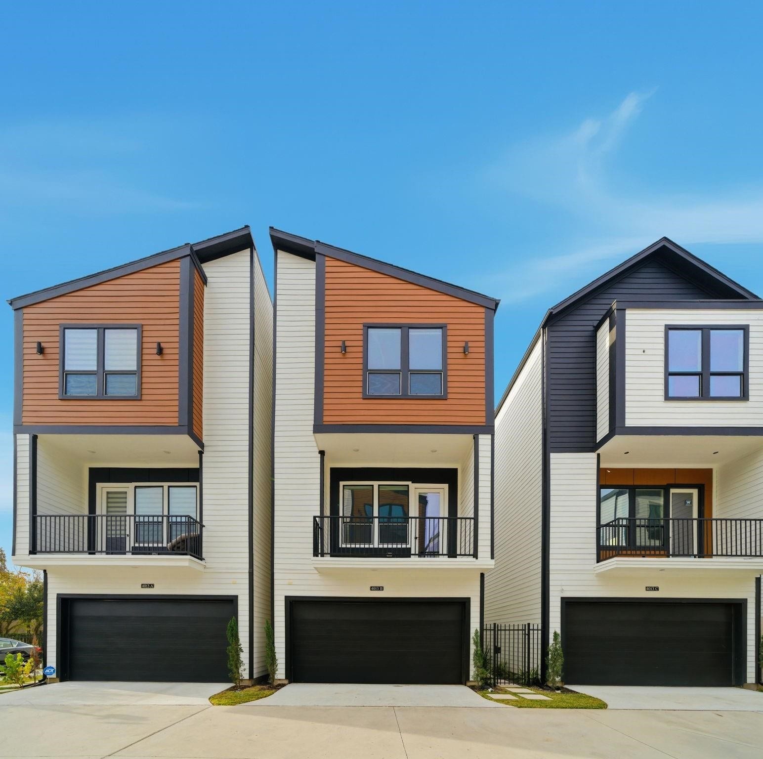 4013 Griggs Road, #F, Houston, TX 77021 Modern townhomes with sleek designs featuring two-car garages, stylish balconies, and contemporary finishes.