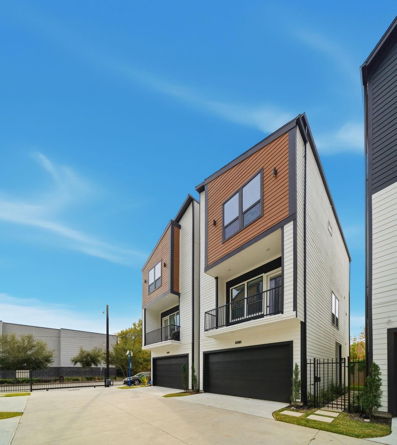 4013 Griggs Road, #F, Houston, TX 77021 Modern townhomes with sleek design, featuring spacious balconies and two-car garages, set in a well-maintained community.