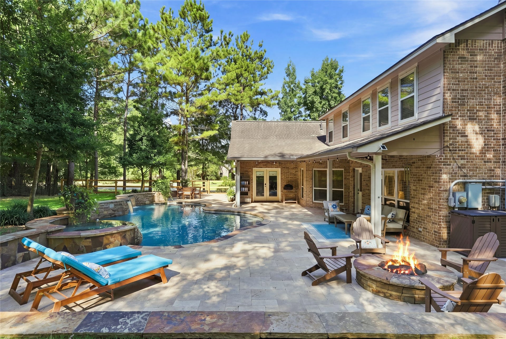 Covered patio, fire pit, pool deck, heated pool, hot tub, and much more.