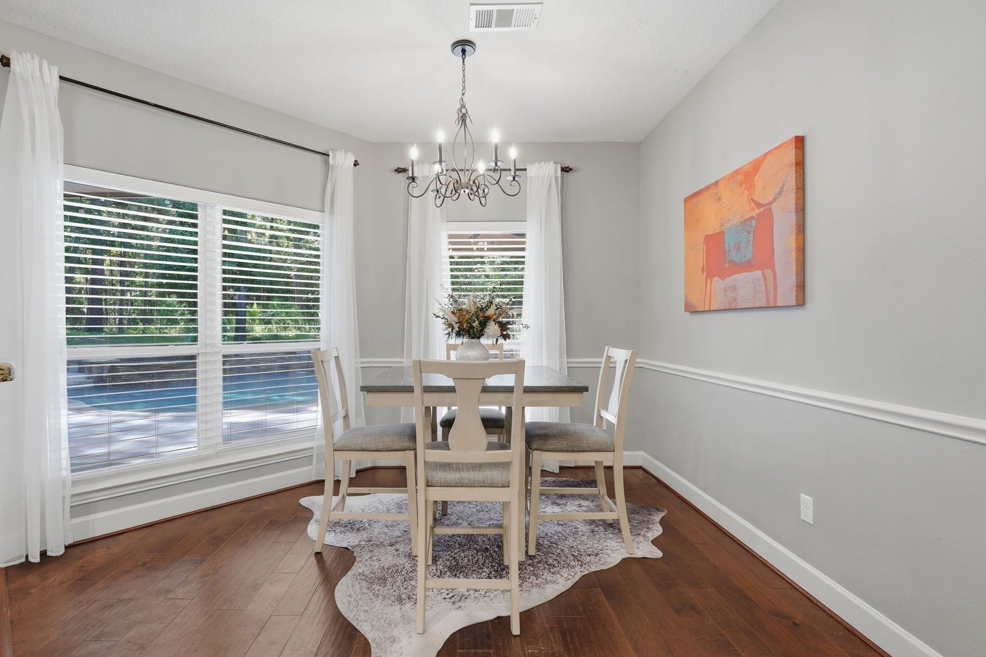 off the kitchen is the breakfast nook with pool views.