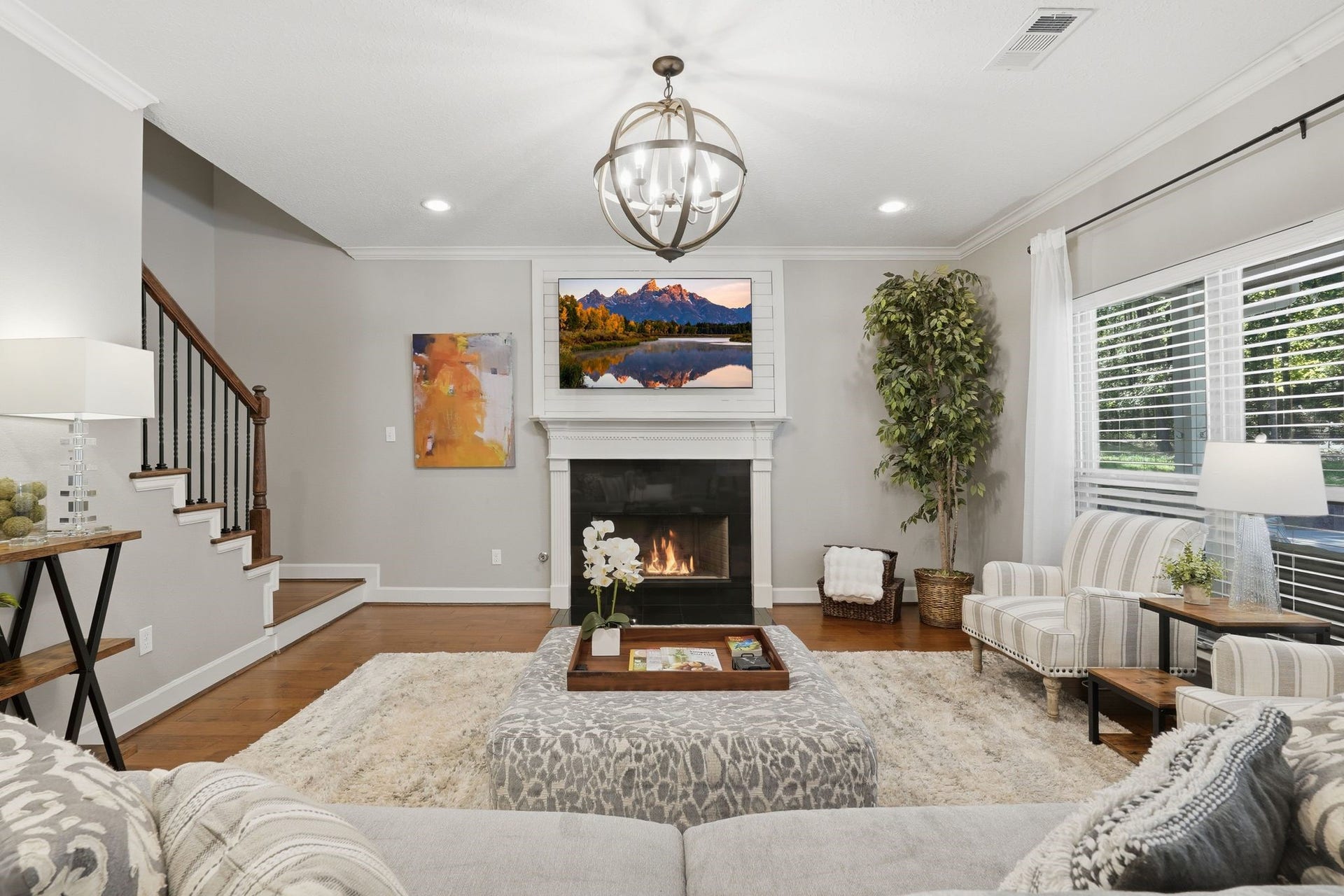 Another view of the cozy family room open to the kitchen, views of the pool