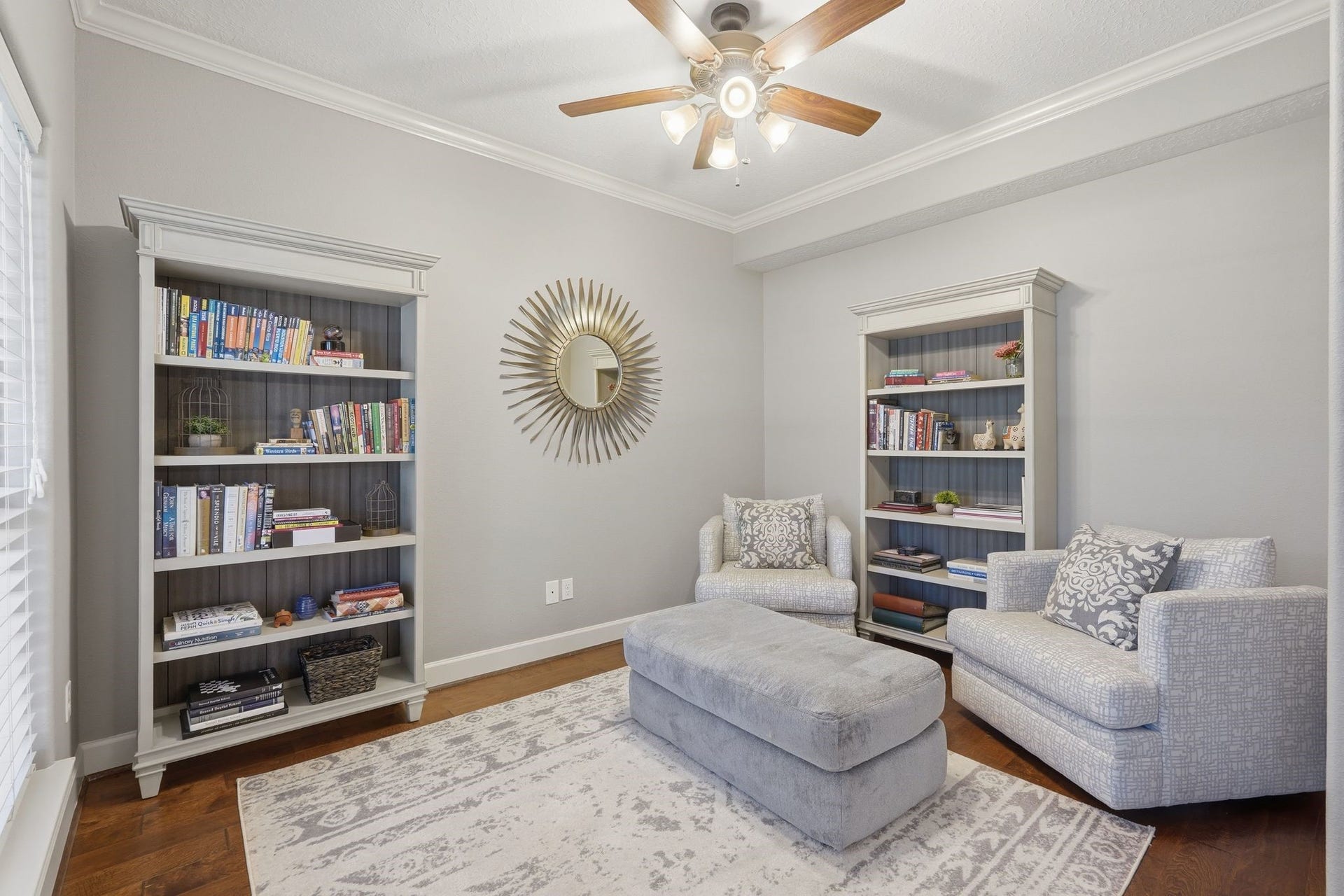 First floor study near the front entrance with hardwood flooring and double French doors offering a work-from-home experience with views of the acreage and nature outside the windows.