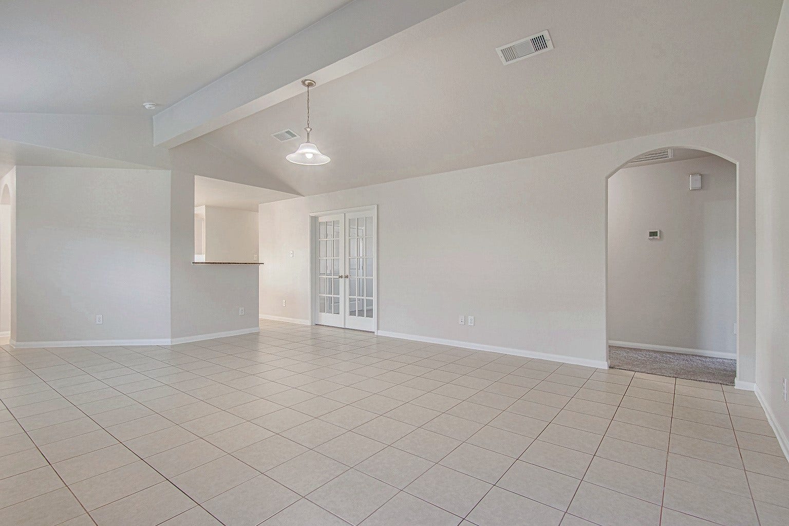 1223 Emerald Stone Drive, Rosharon, TX 77583 Another view of the living room showcases its open layout and connection to the kitchen and adjoining spacesideal for gathering and entertaining.