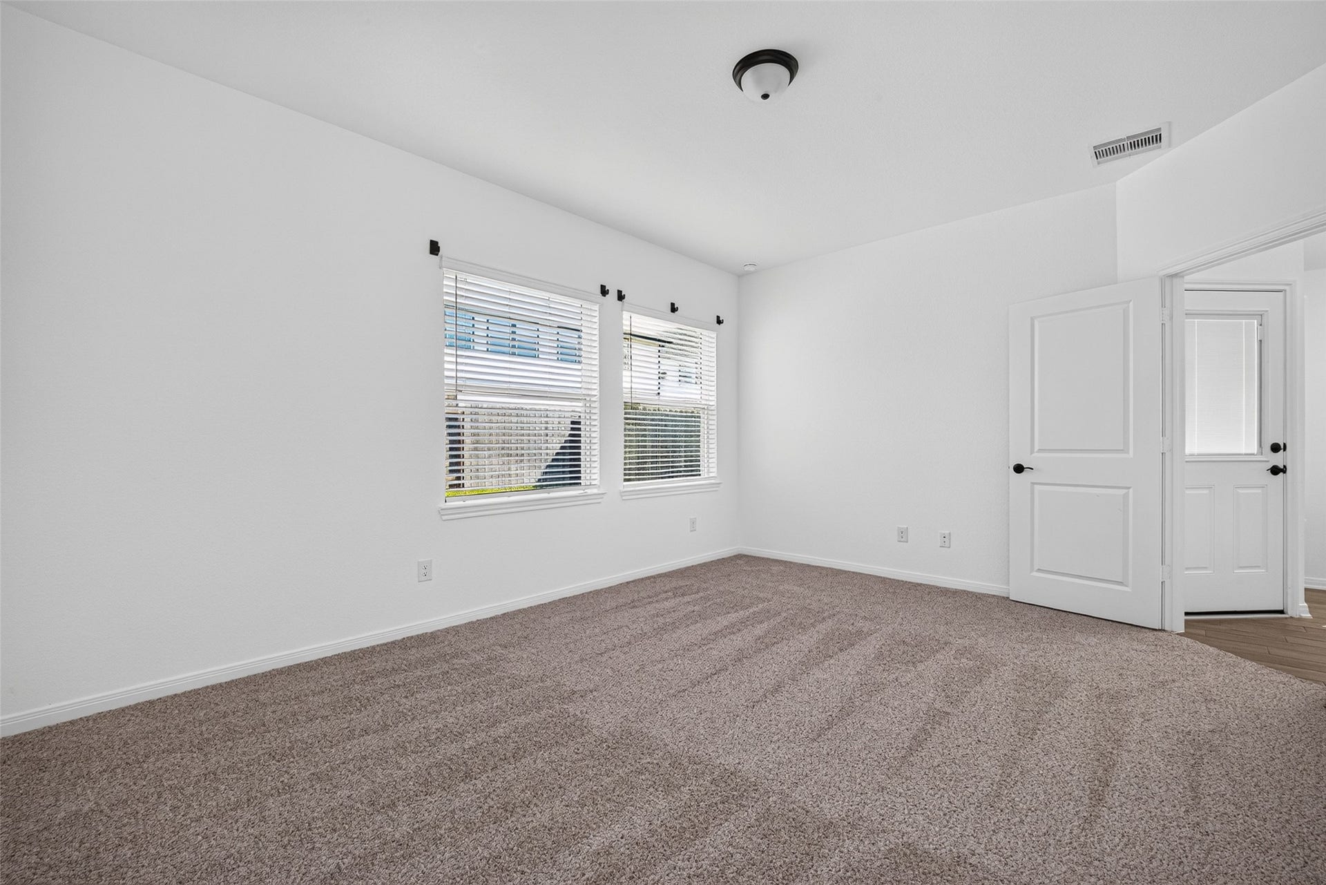 146 W Coralburst Loop, Montgomery, TX 77316 Primary bedroom at the end of the house with views of the backyard
