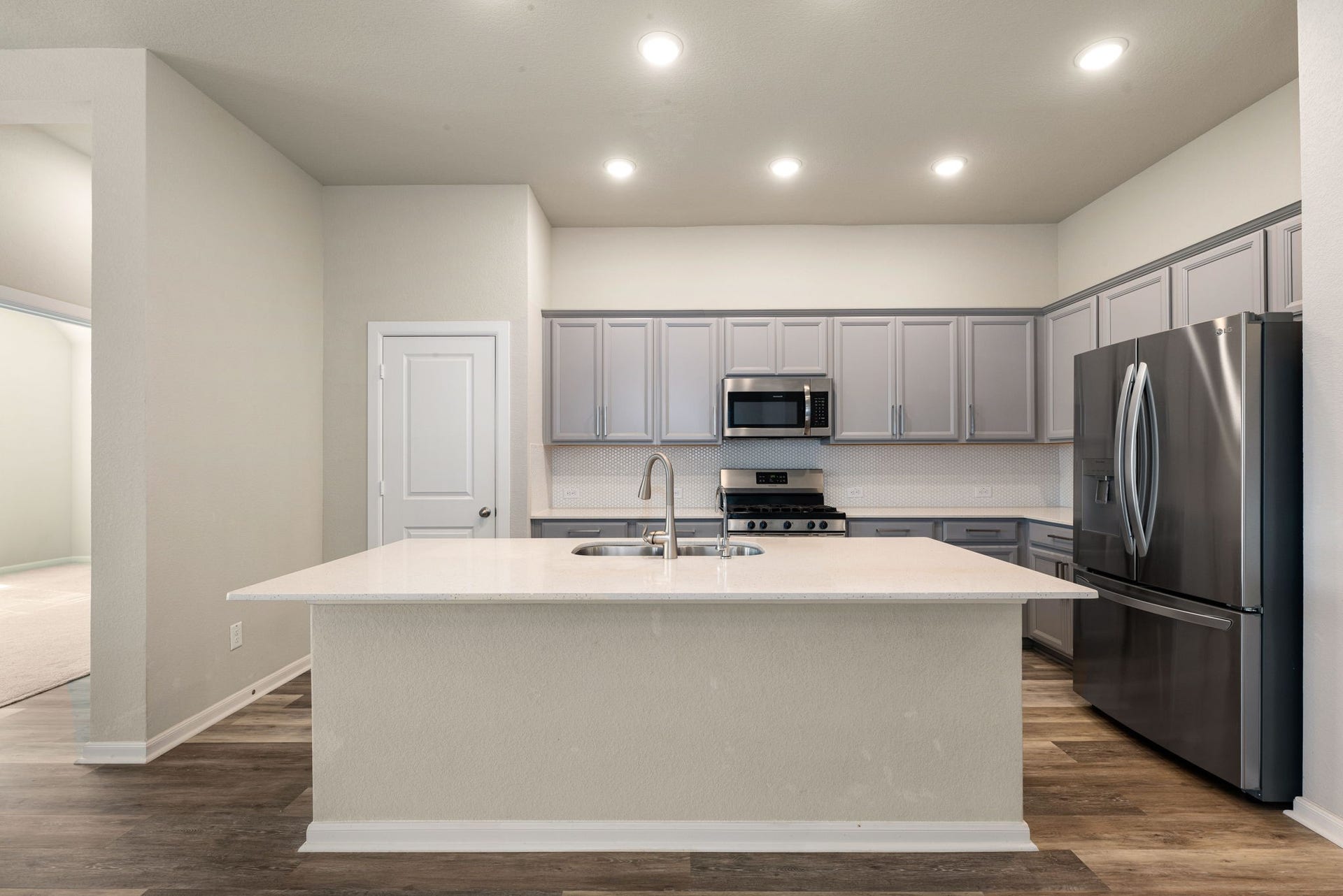 2715 Chestnut Oak Circle, Katy, TX 77494 Features a large island with quartz countertops , perfect for meal prep, entertaining, or casual dining