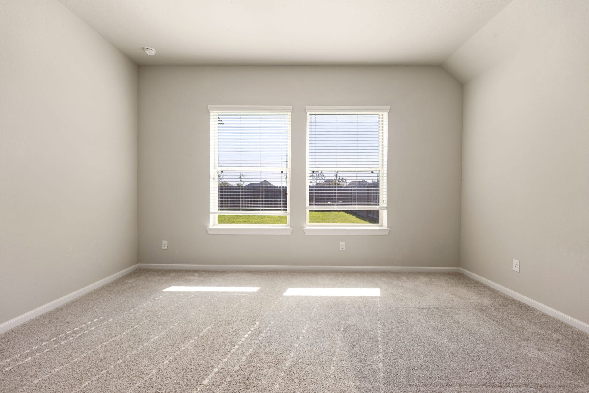 2715 Chestnut Oak Circle, Katy, TX 77494 Master bedroom features a peaceful view and plush carpeting for added comfort