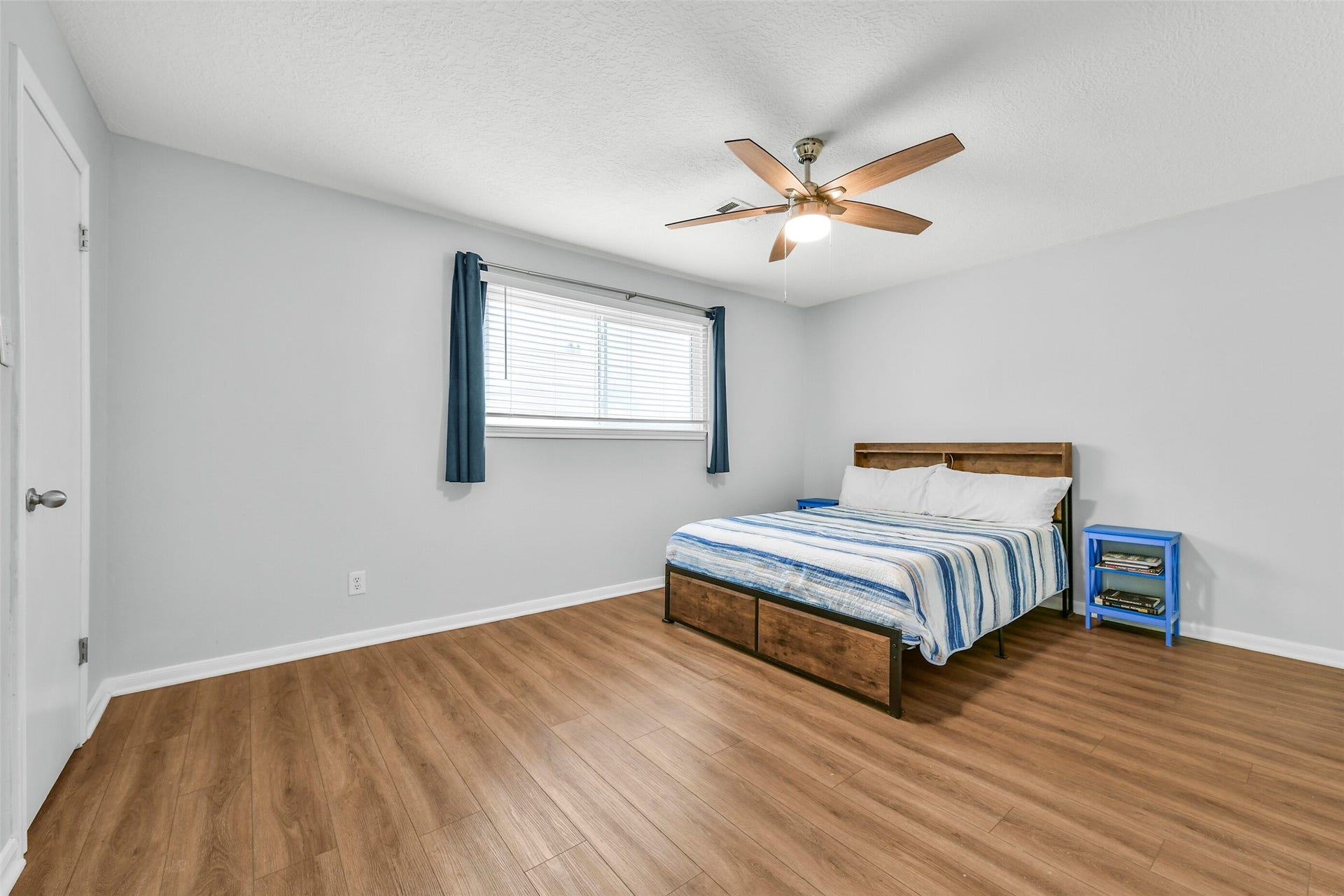 19611 Suncove Lane, Humble, TX 77346 Space to make yourself comfortable. This alternate bedroom view highlights the generous furniture placement options and uncluttered layout, offering a versatile backdrop for everyday living or welcoming guests.