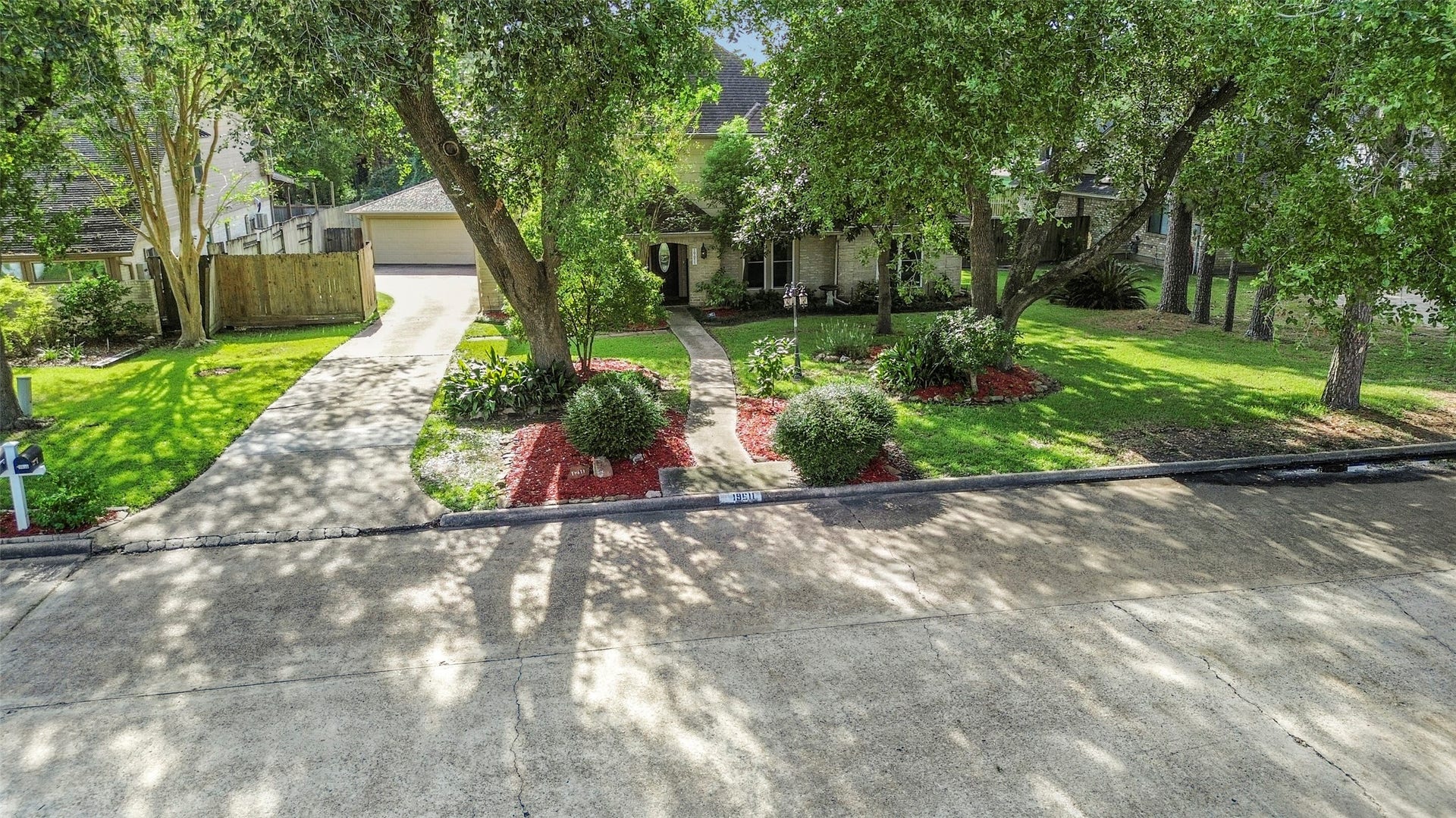19611 Suncove Lane, Humble, TX 77346 Come home to a canopy of mature trees and timeless curb appeal. A sweeping lawn, inviting walkway and garage tucked to the side create a welcoming first impression with plenty of character.