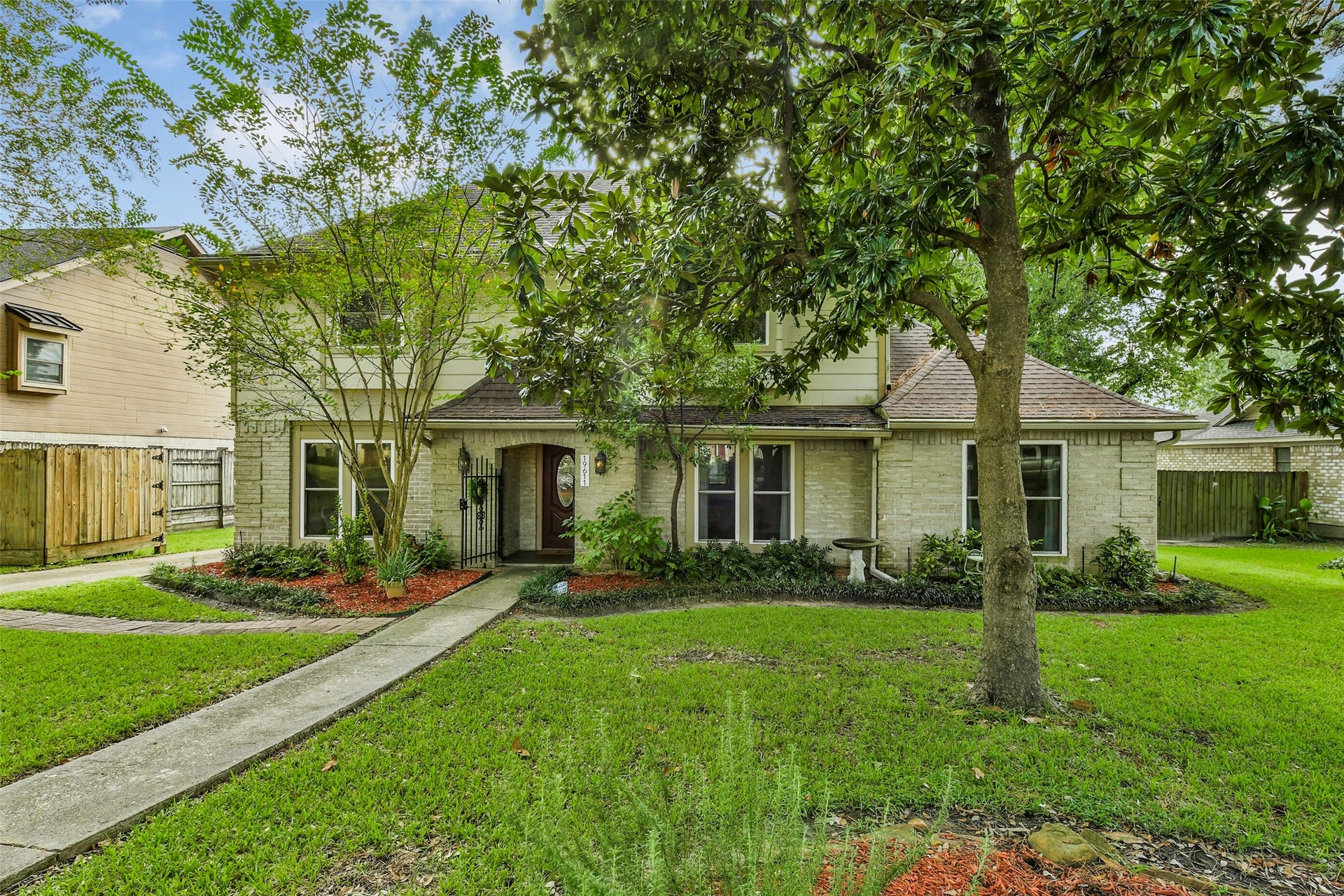 19611 Suncove Lane, Humble, TX 77346 Classic charm beneath the trees. Soft exterior tones, brick accents and thoughtfully landscaped beds give this home a warm, established feel that welcomes you before you reach the front door.