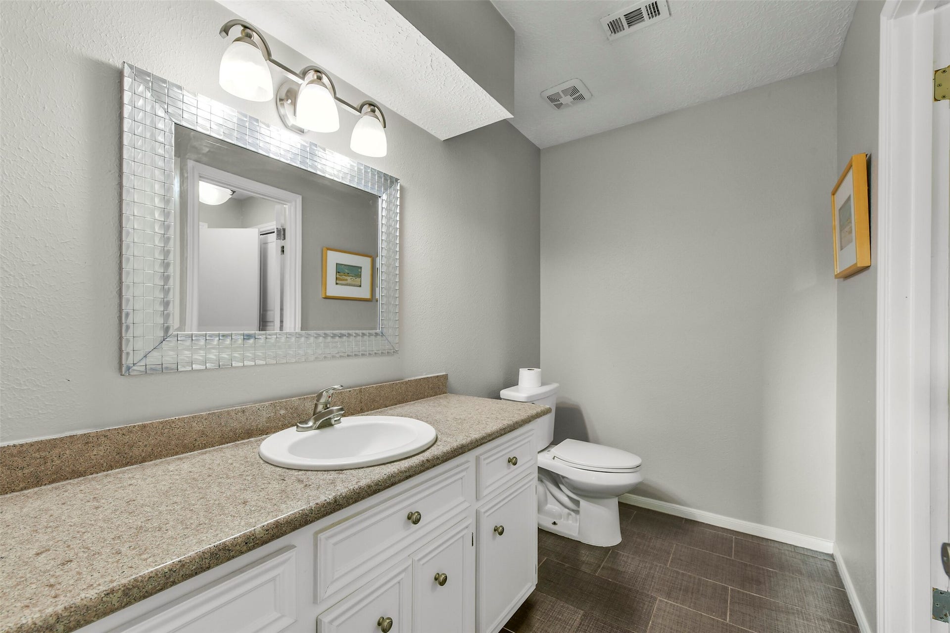 19611 Suncove Lane, Humble, TX 77346 Room to rest, play and make the space your own. This generous bedroom comfortably accommodates two beds, while natural light and warm wood-look flooring create a cheerful, inviting atmosphere.