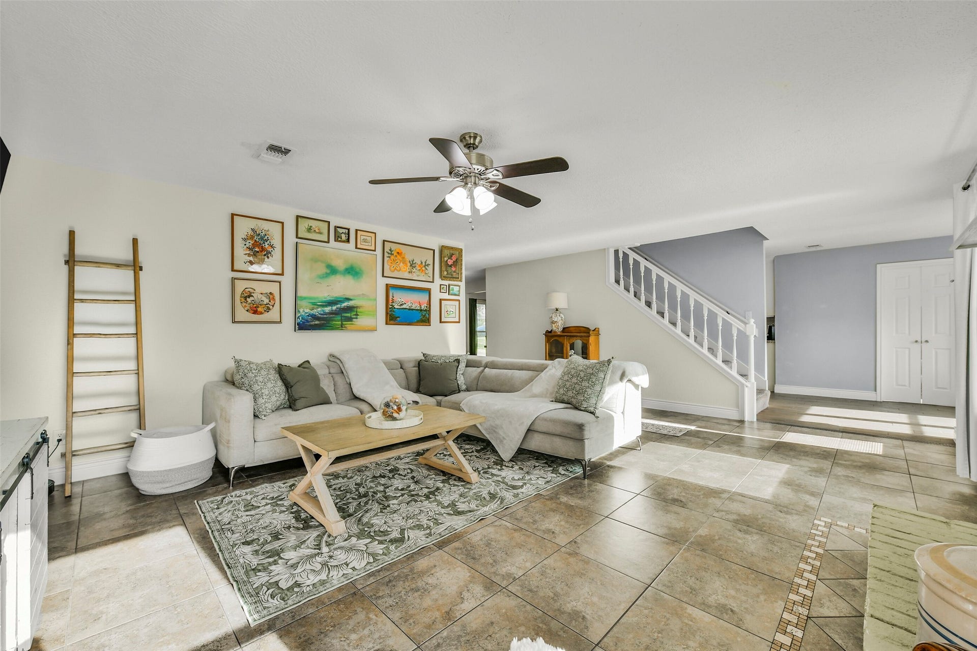 19611 Suncove Lane, Humble, TX 77346 Stretch out, settle in and make yourself at home. The spacious living area offers flexibility for a generous furniture arrangement, with an open connection to the staircase and adjoining spaces that keeps daily life flowing.